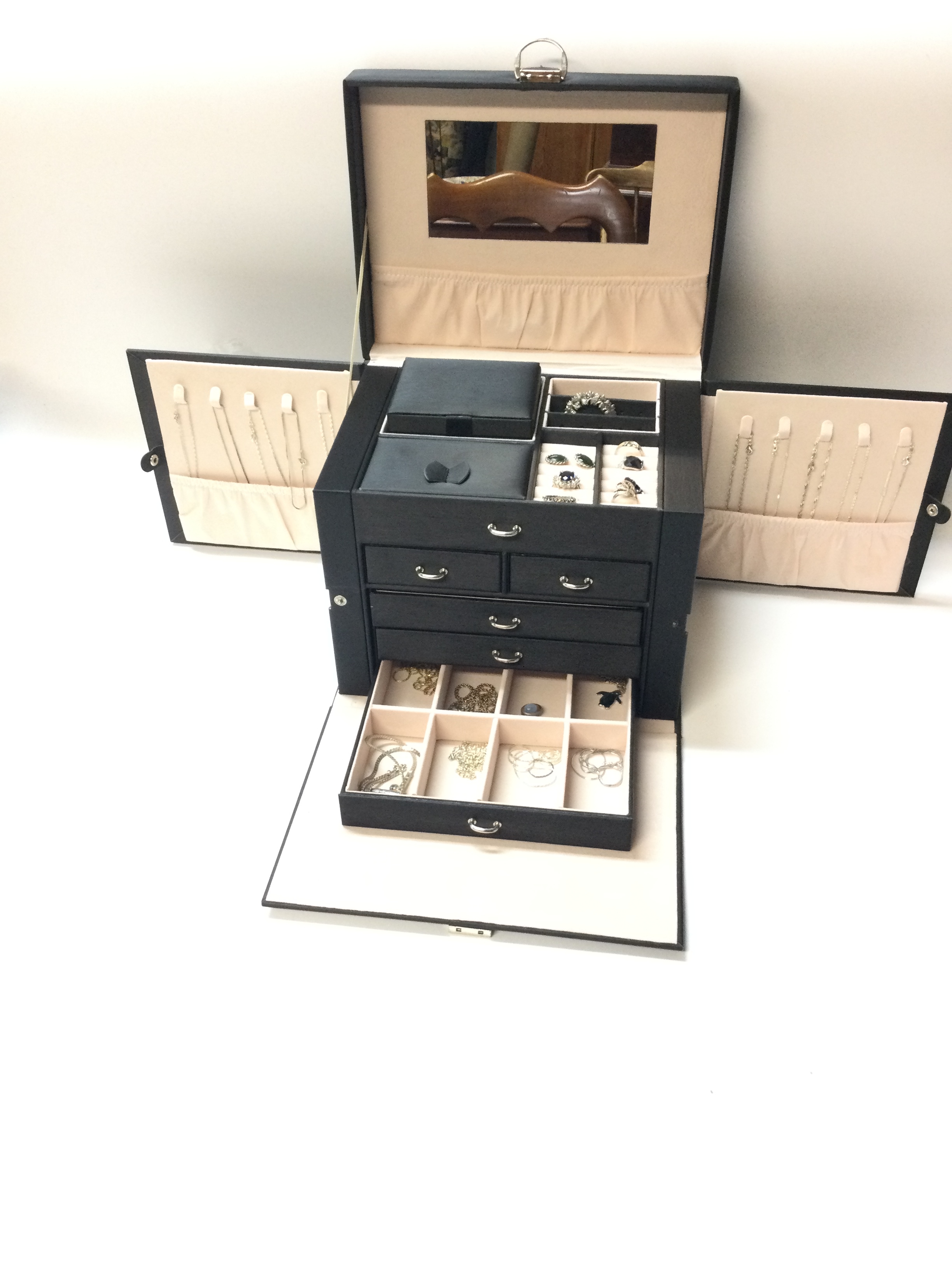 large travel case  with silver rings, necklaces 