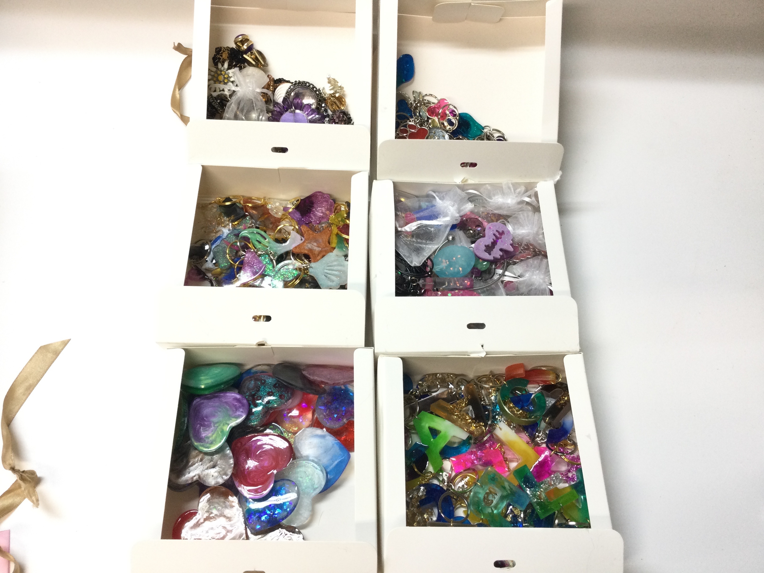 Quantity key rings and and dress jewellery (six boxes)
