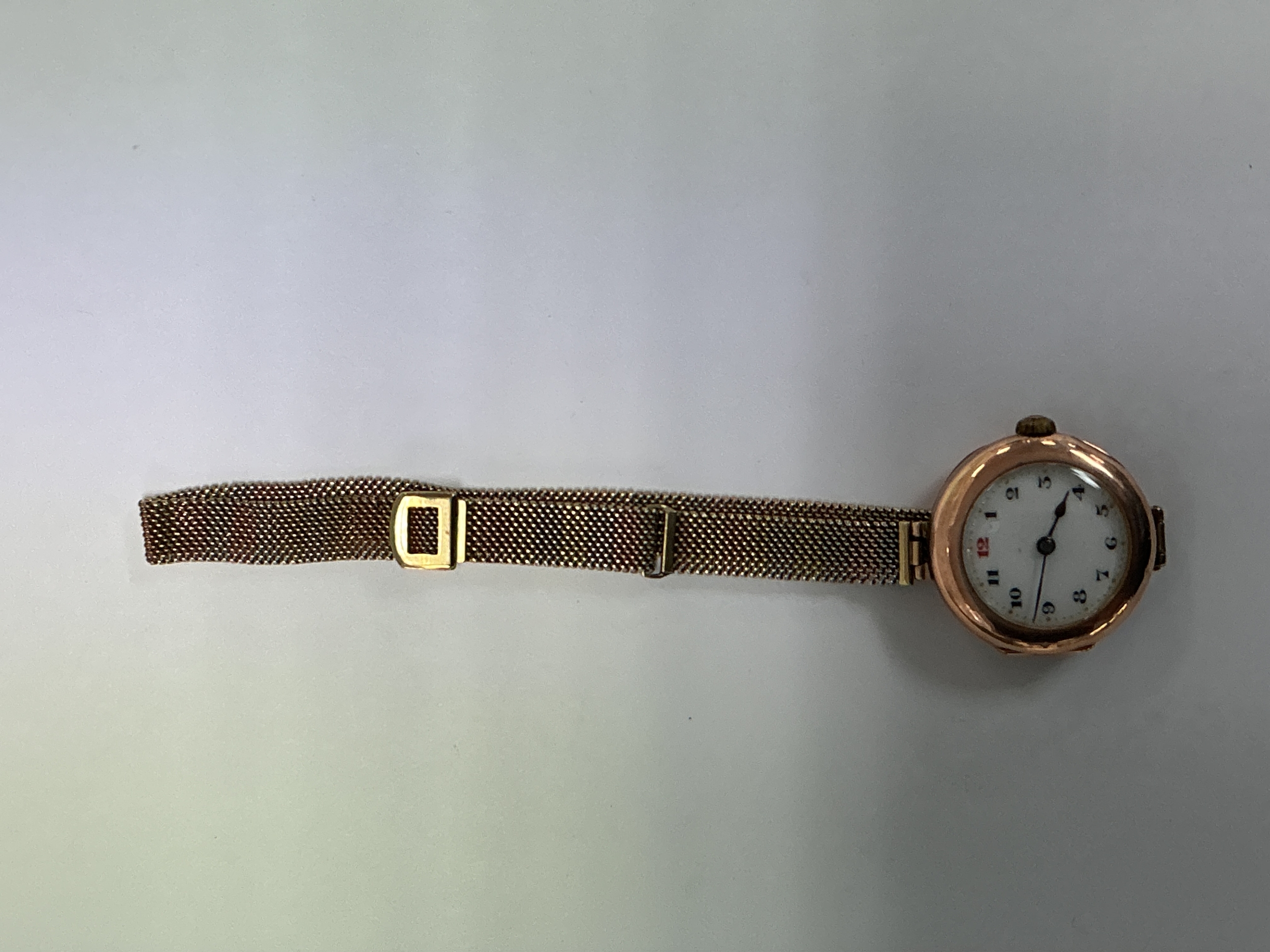 A vintage lady's 9ct gold Rolex wristwatch on multi tone gold mesh  strap.  Approx: 5cm closed x 2.5cm face.27.90 g