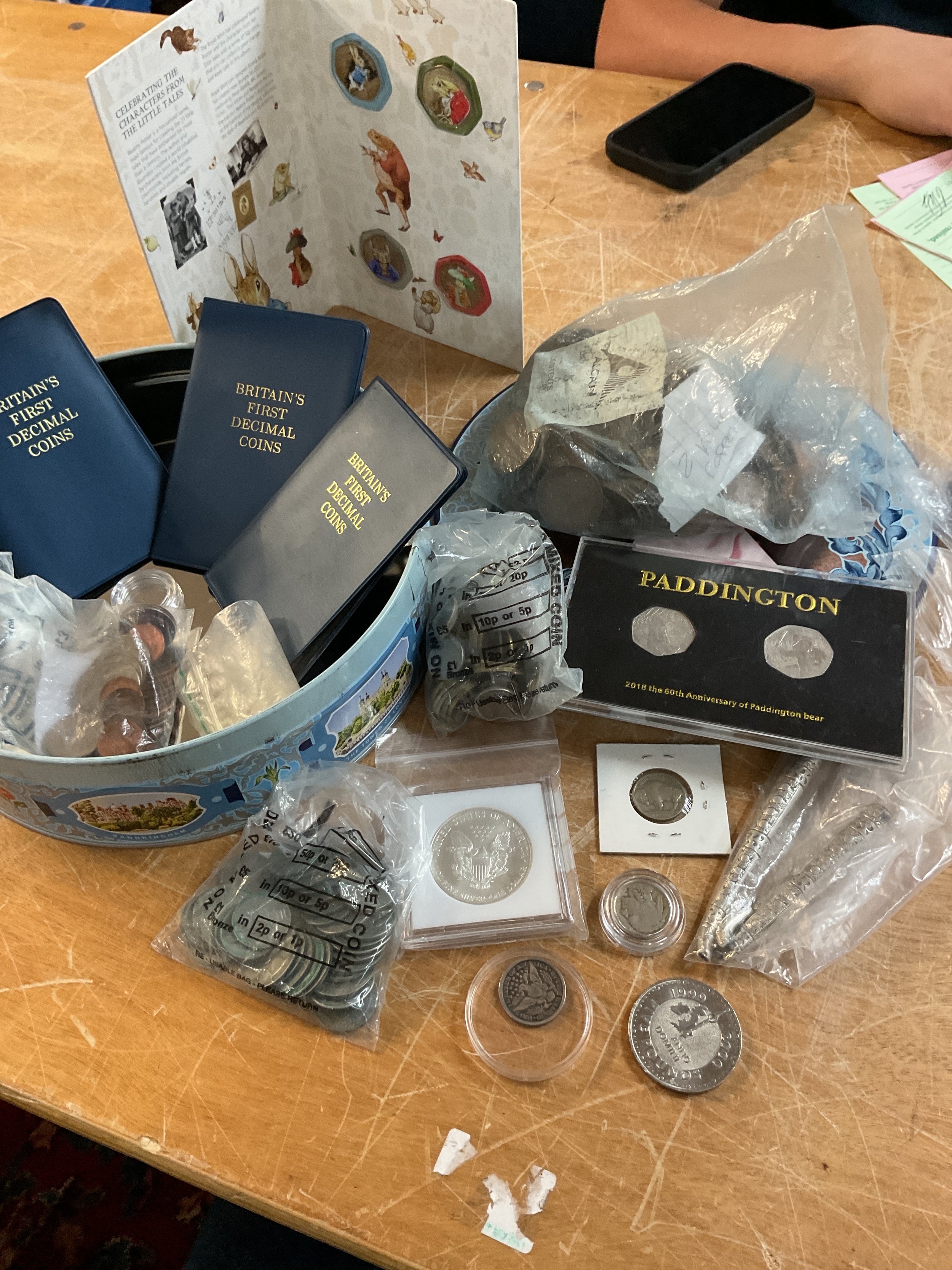 Tin of coins to inc pure silver dollar, world coins, pennies, 1897 quarter, Decimal sets, Paddington 50 p, Beatrix Potter coloured 50 p etc.