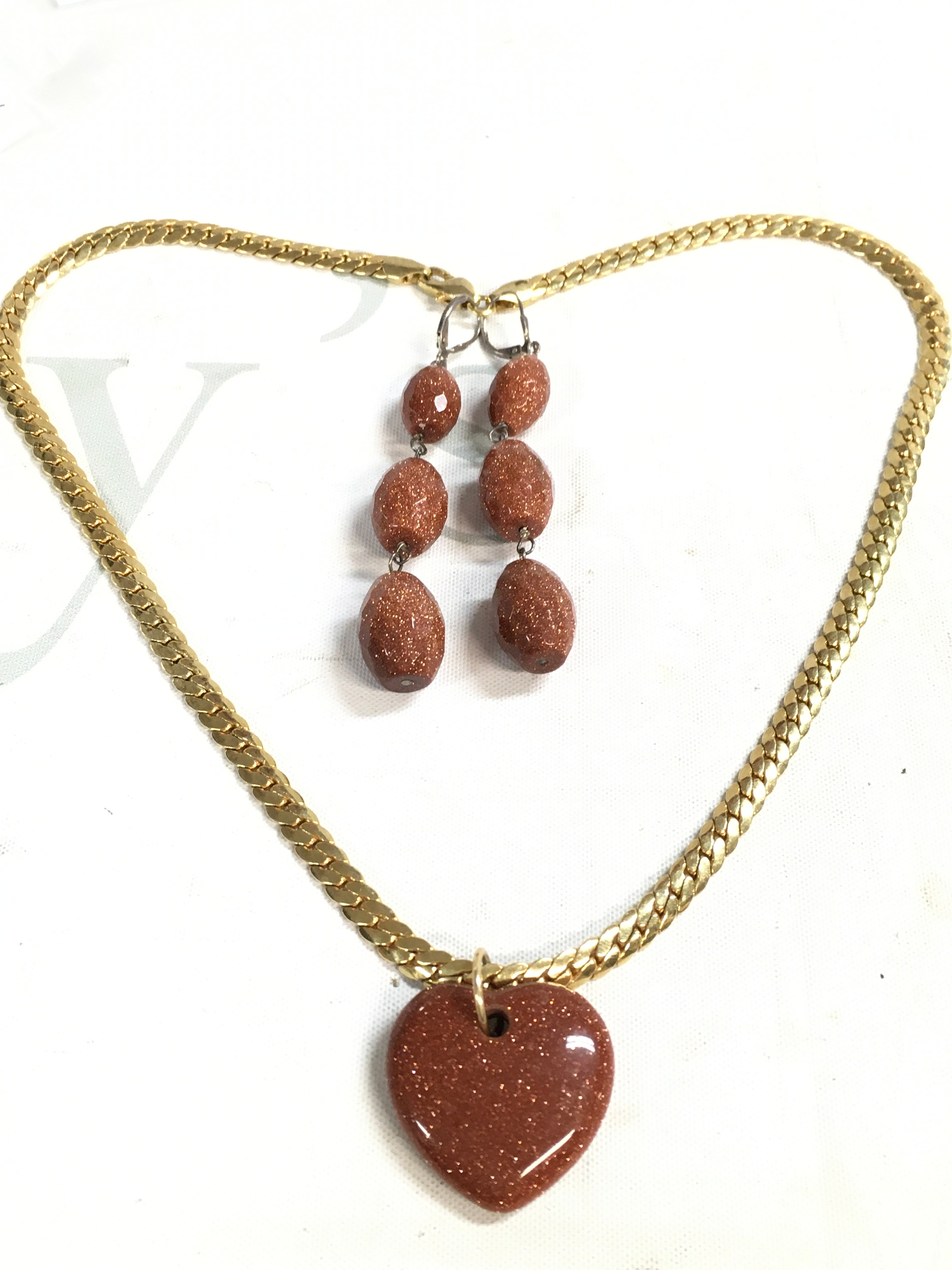 Goldstone heart pendant on chain, pair of goldstone earrings 