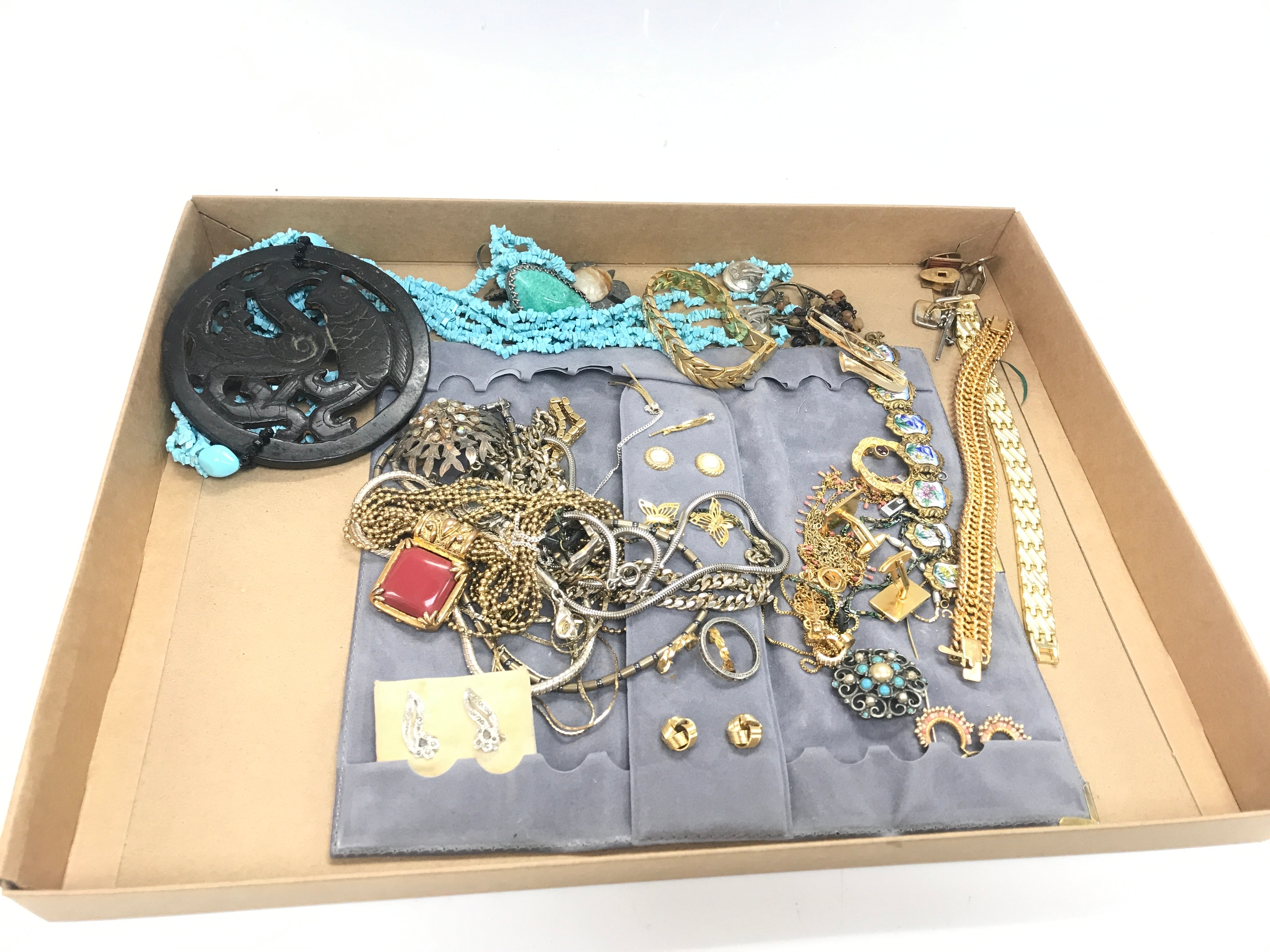 White and gold metal dress jewellery.