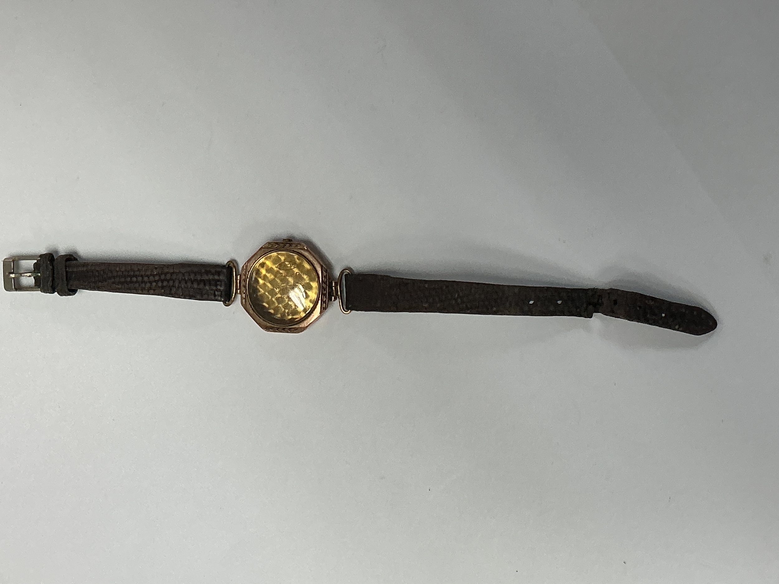 A lady's vintage 9ct gold, empty Rolex wristwatch, having octagonal face. Approx 7.5 cm x 2.5cm face.8.09g