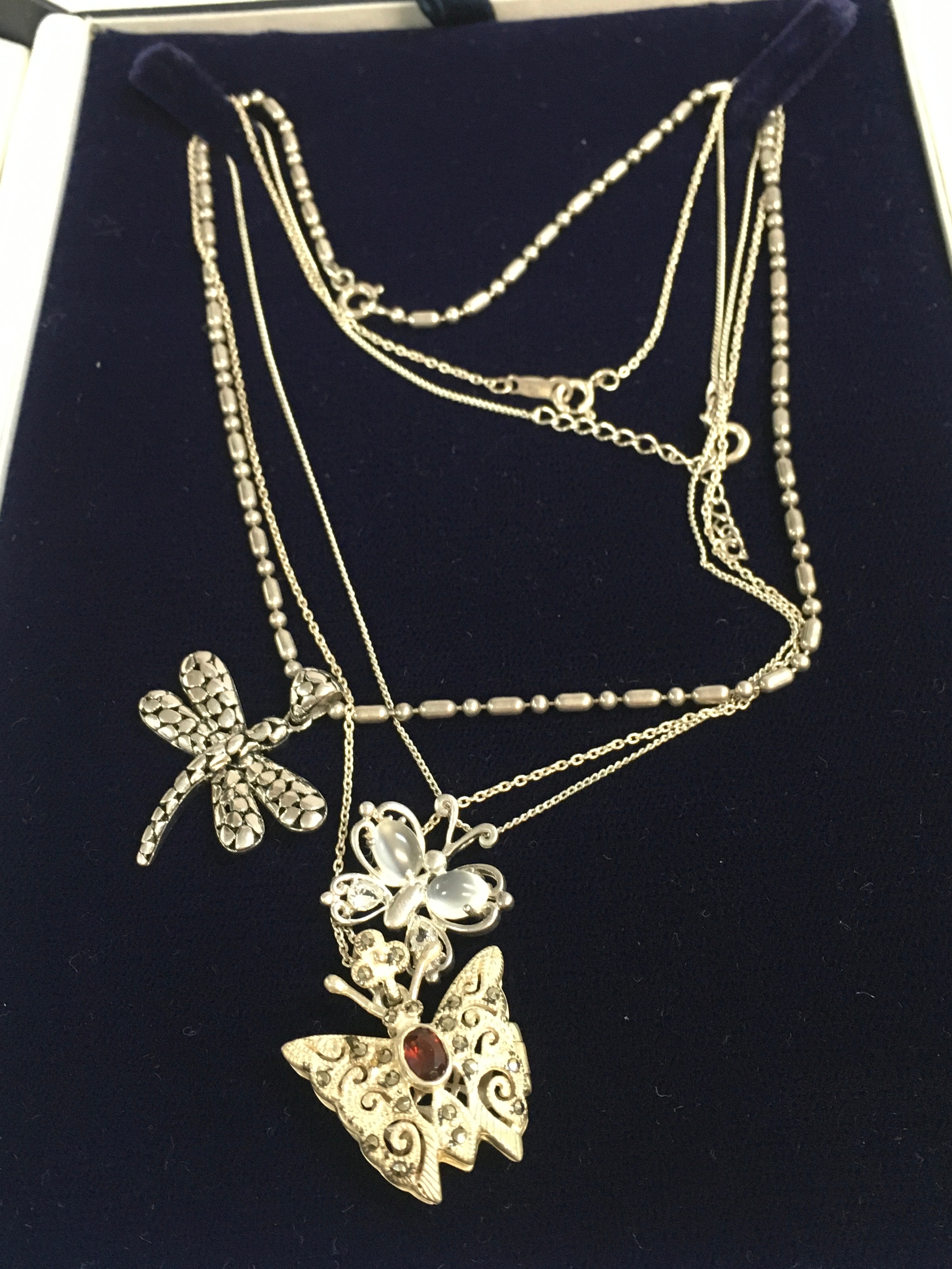 Silver necklaces and pendants including garnet butterfly, other butterfly and dragon fly