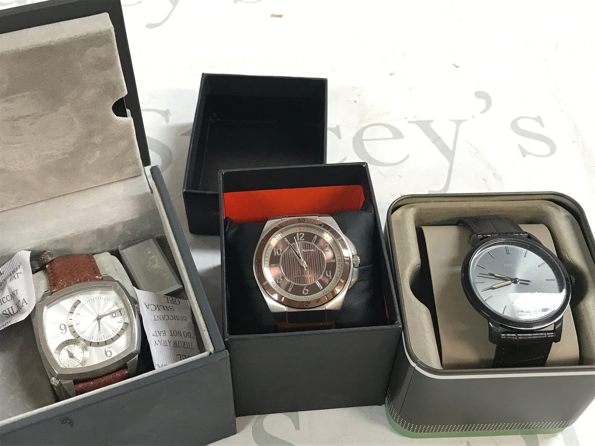 Three boxes gents watches including Guess , Ben Sherman and Fossil 