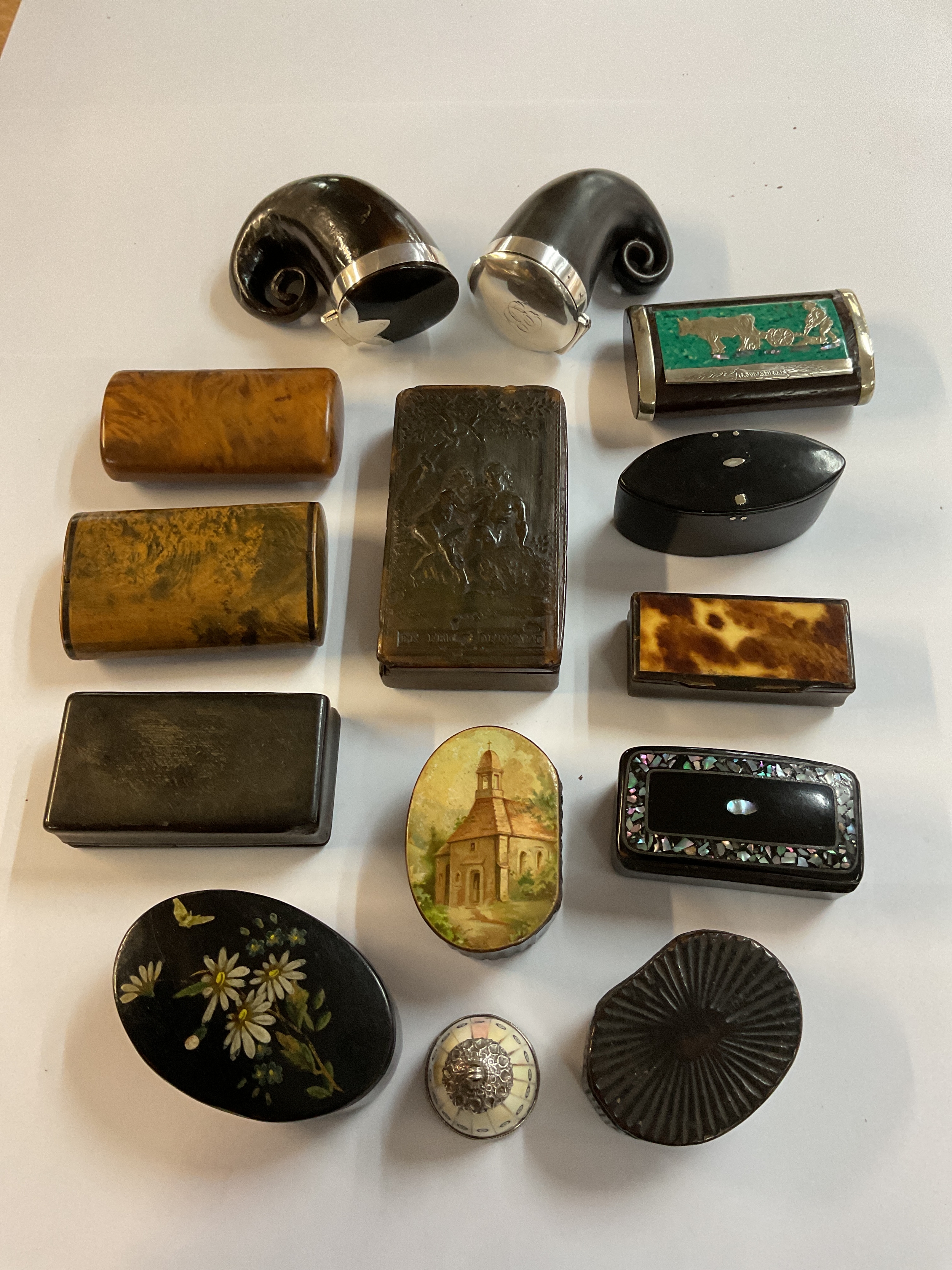 A fine collection of 13 snuff boxes, some 18 th C examples including two snuff Mulls, along with examples in wood, bone and papier mache, an early French Adam and Eve box plus a white metal and bone watch Fob.
