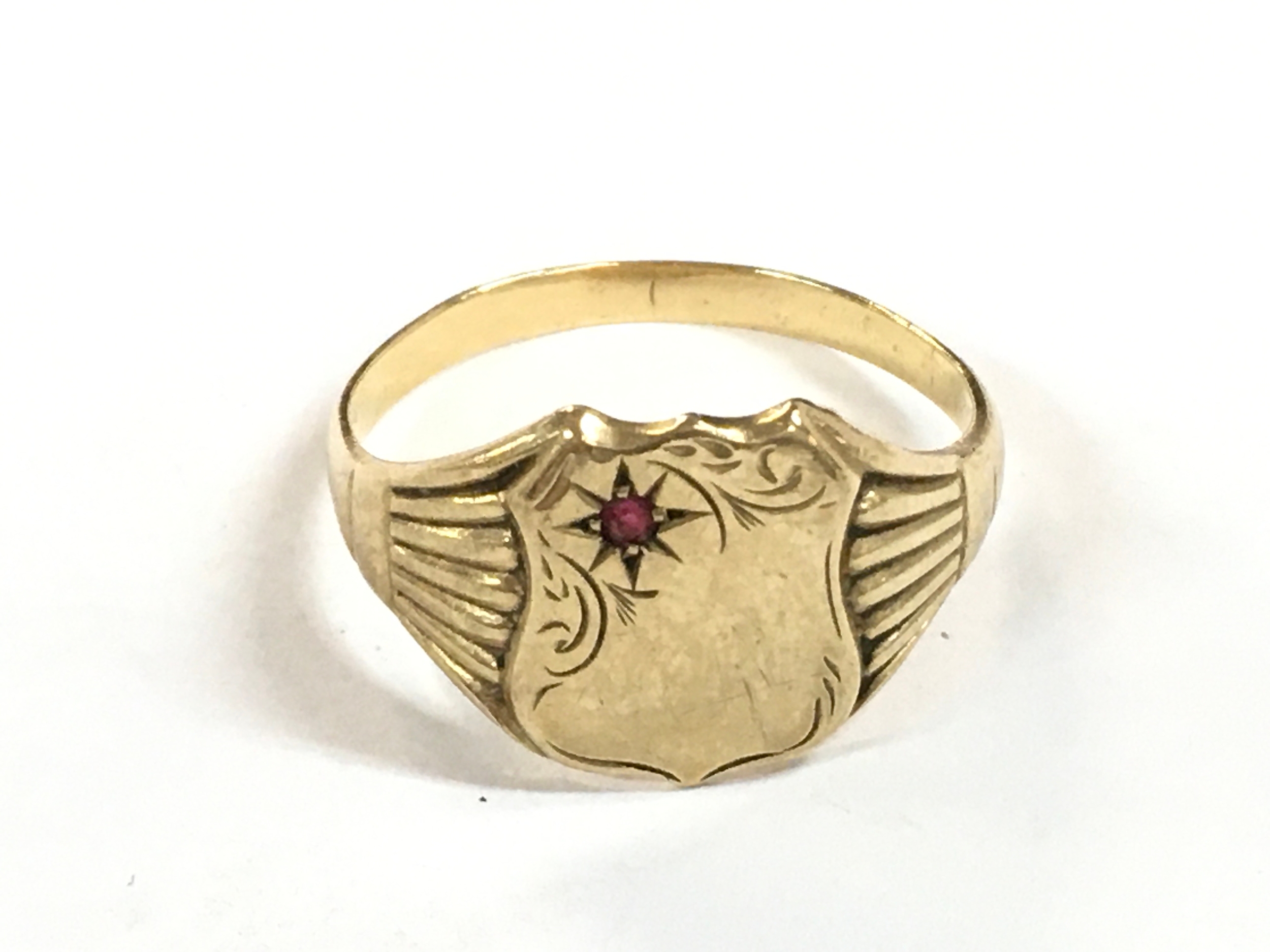 A 9ct gold gents ring, size X.5.6g