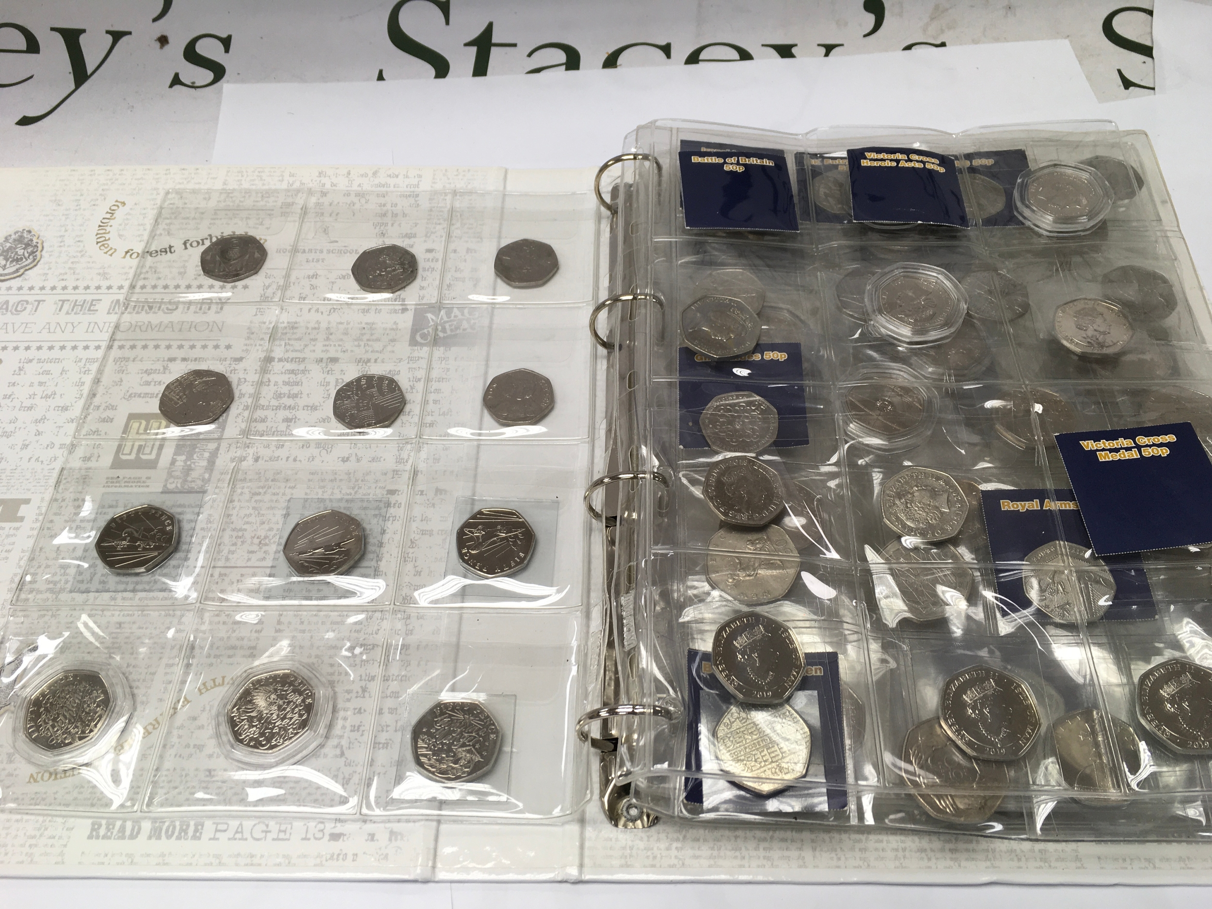 An album of various 50p coins including 2009 Kew Gardens, Christmas coins, WWF coin etc
