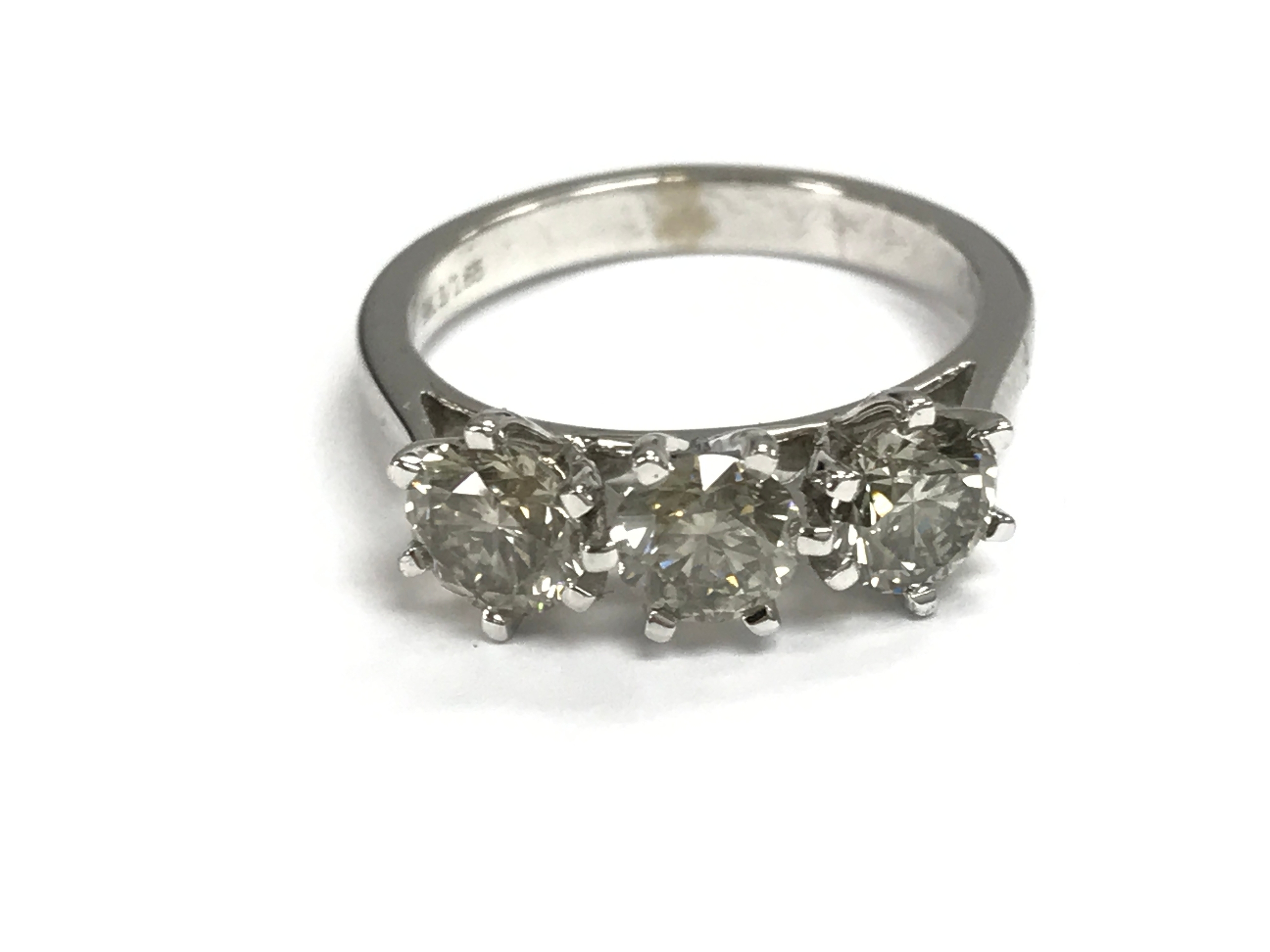A 9ct white gold round cut diamonds trilogy ring. 1.65ct diamonds and size M 1/2