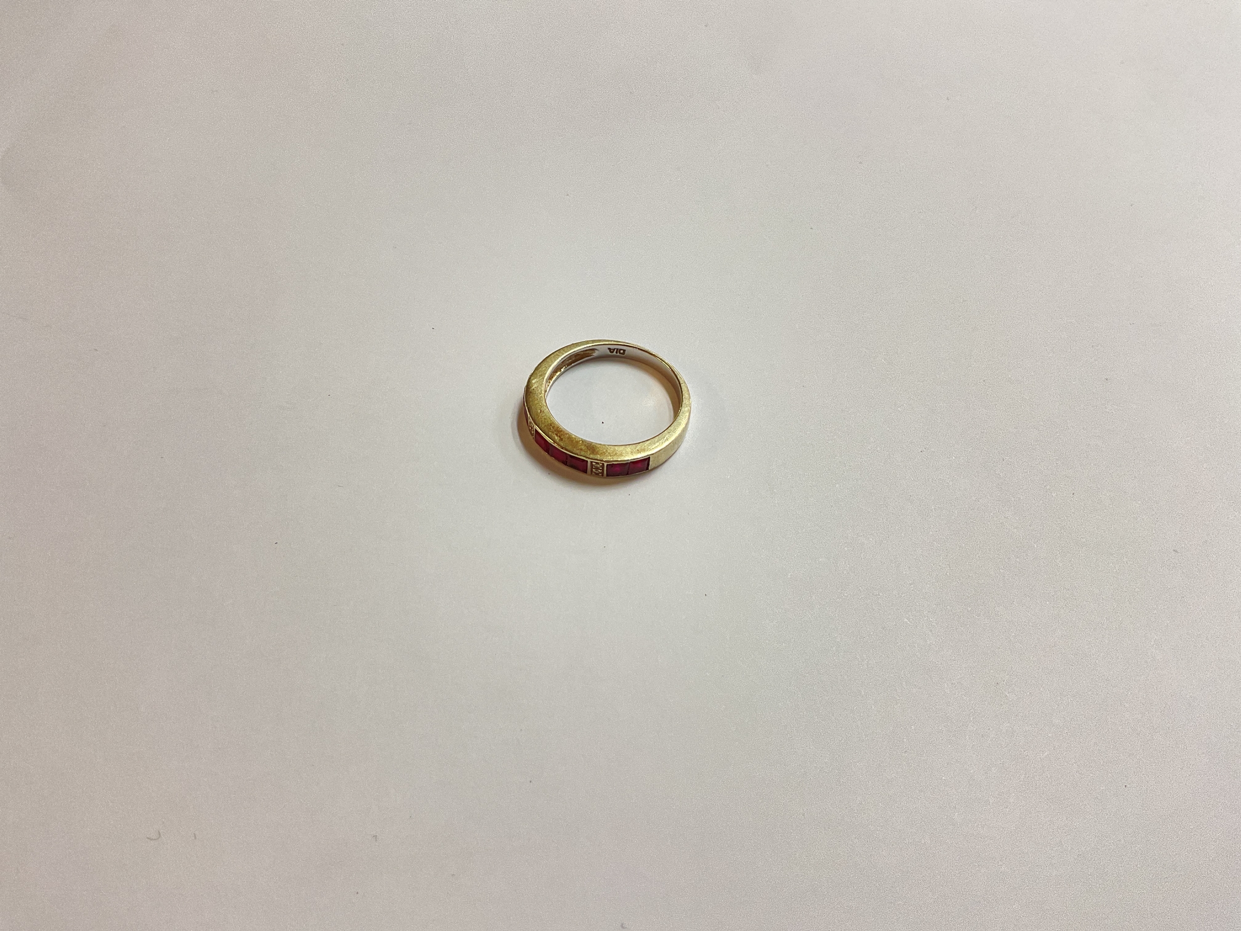 A diamond and ruby set 9ct gold ring 3g
