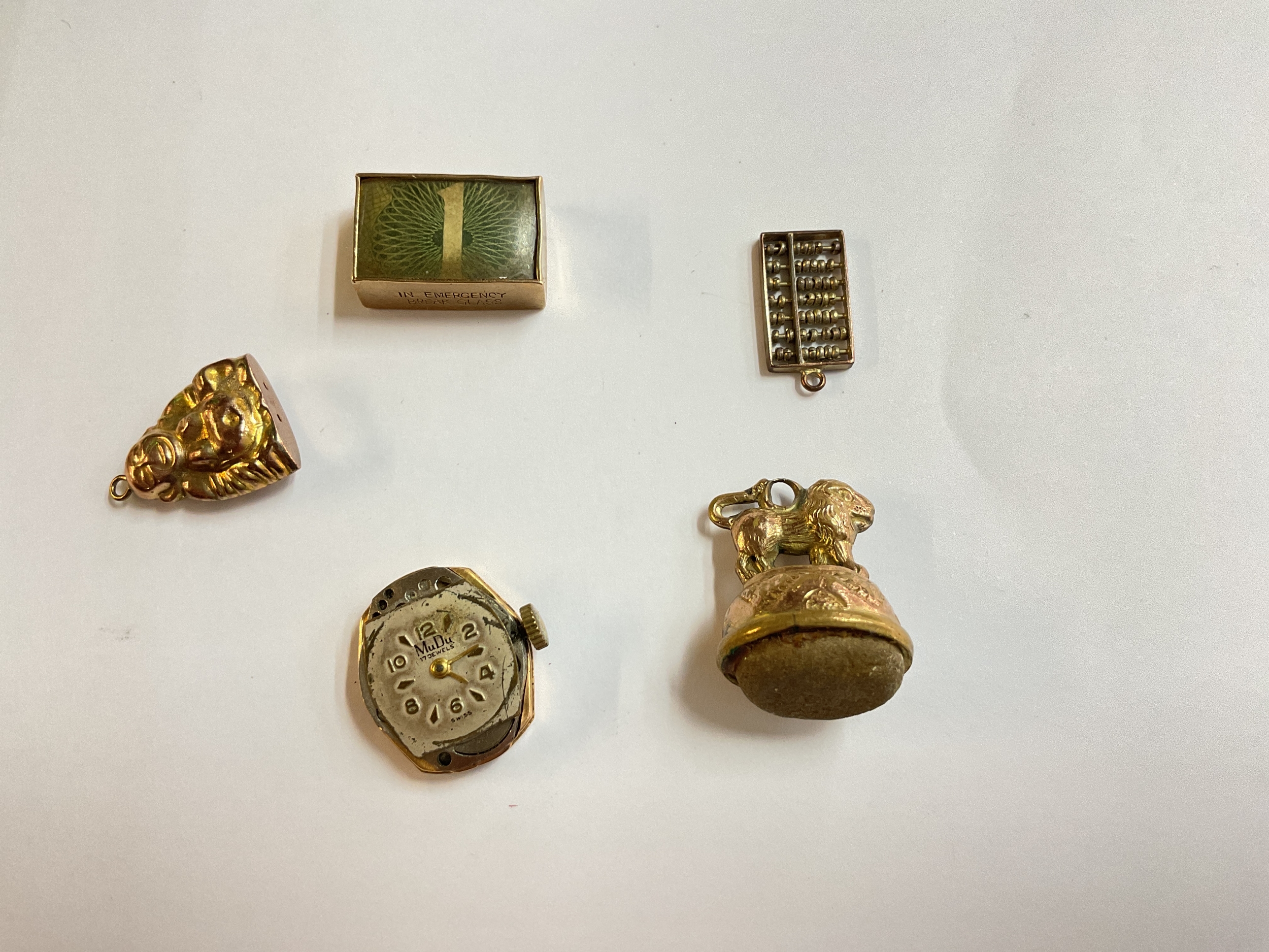 4 9ct fobs and mudu watch in 18ct case 