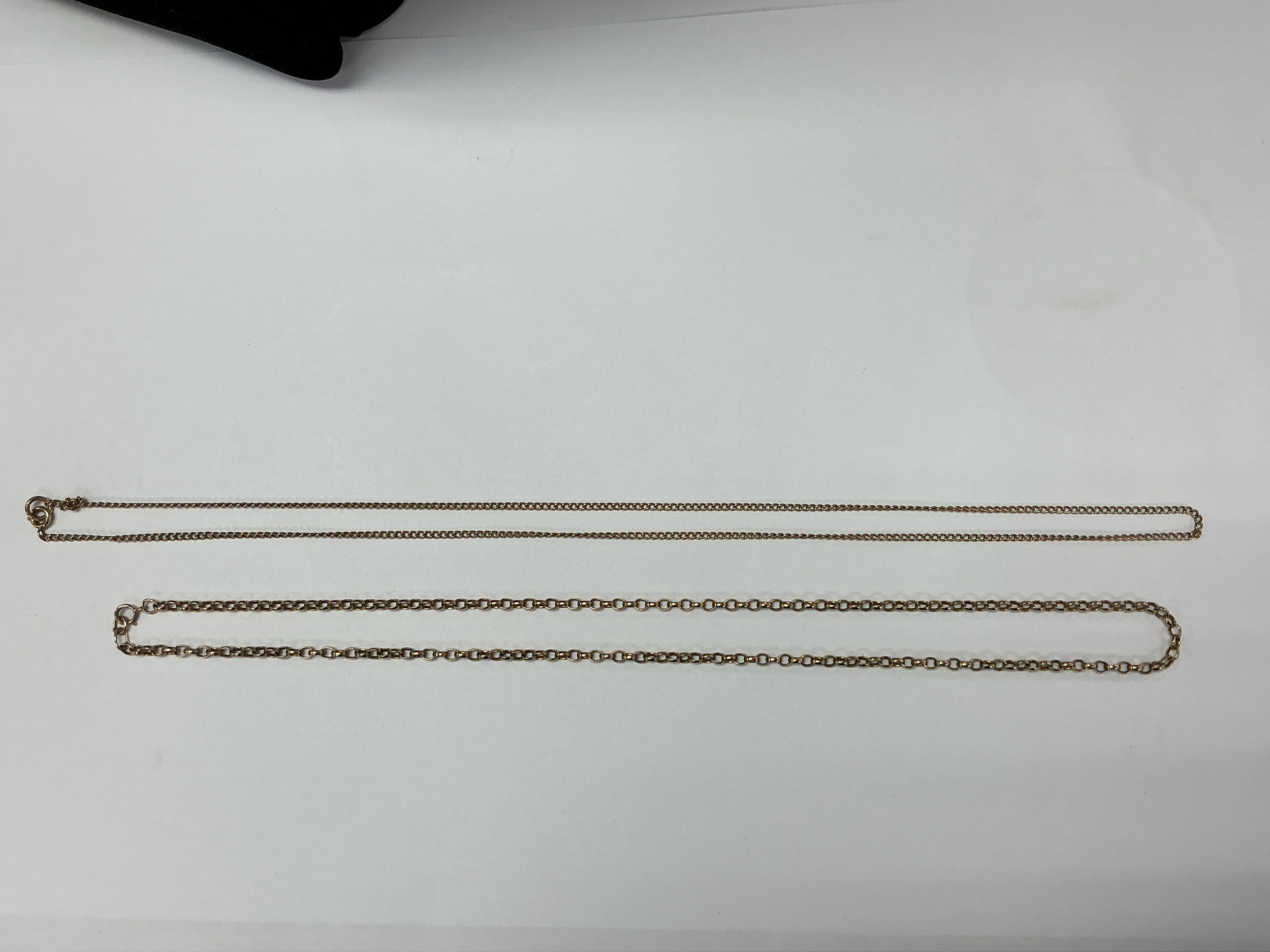 A 9ct gold belcher chain plus one other gold chain, unmarked. Approx 29 and 31cm long. 18.64g
