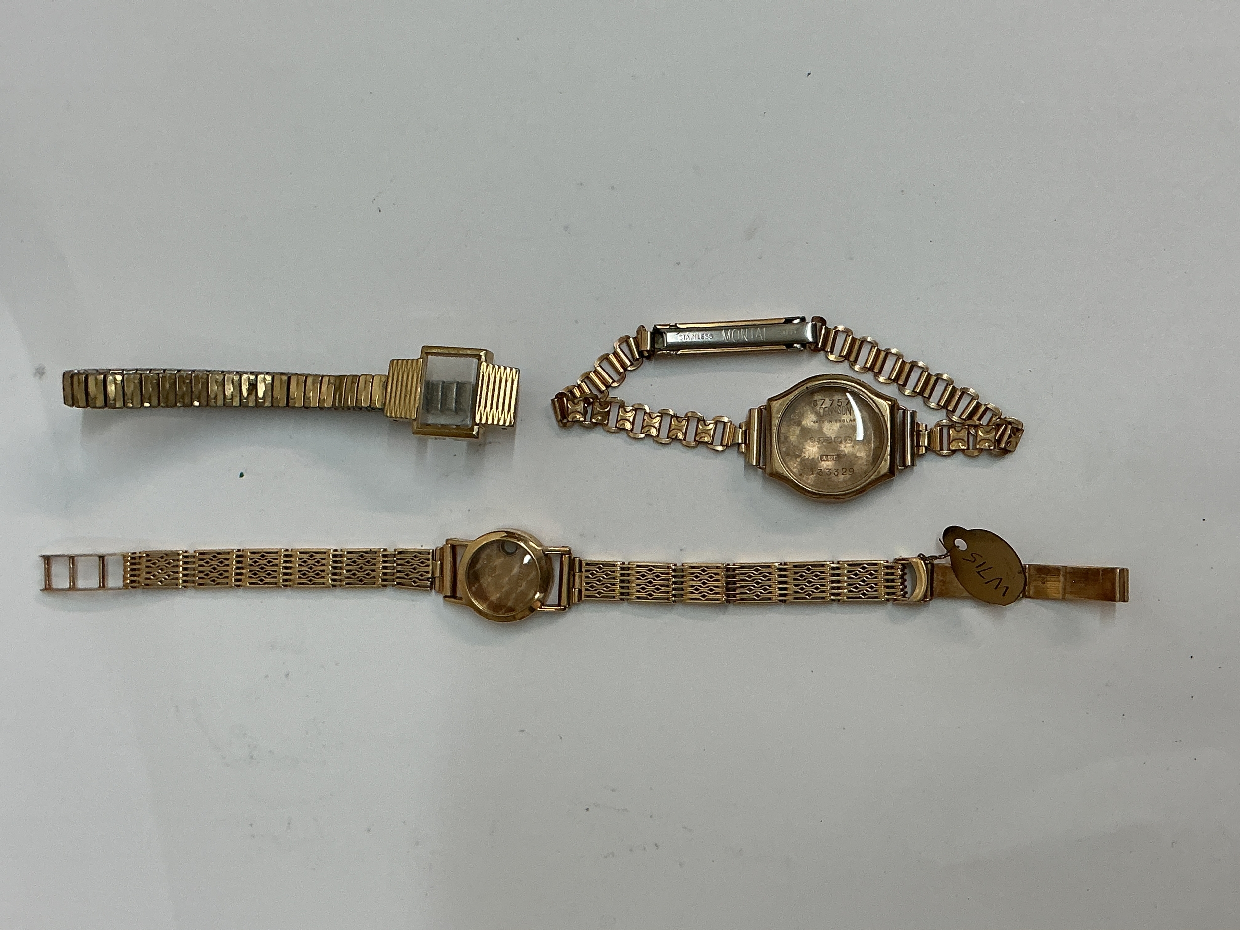 A 9ct gold, empty ladies wristwatch on bracelet strap, plus two other unmarked   yellow metal examples.All small faces, offered for spares or repair 41.3g