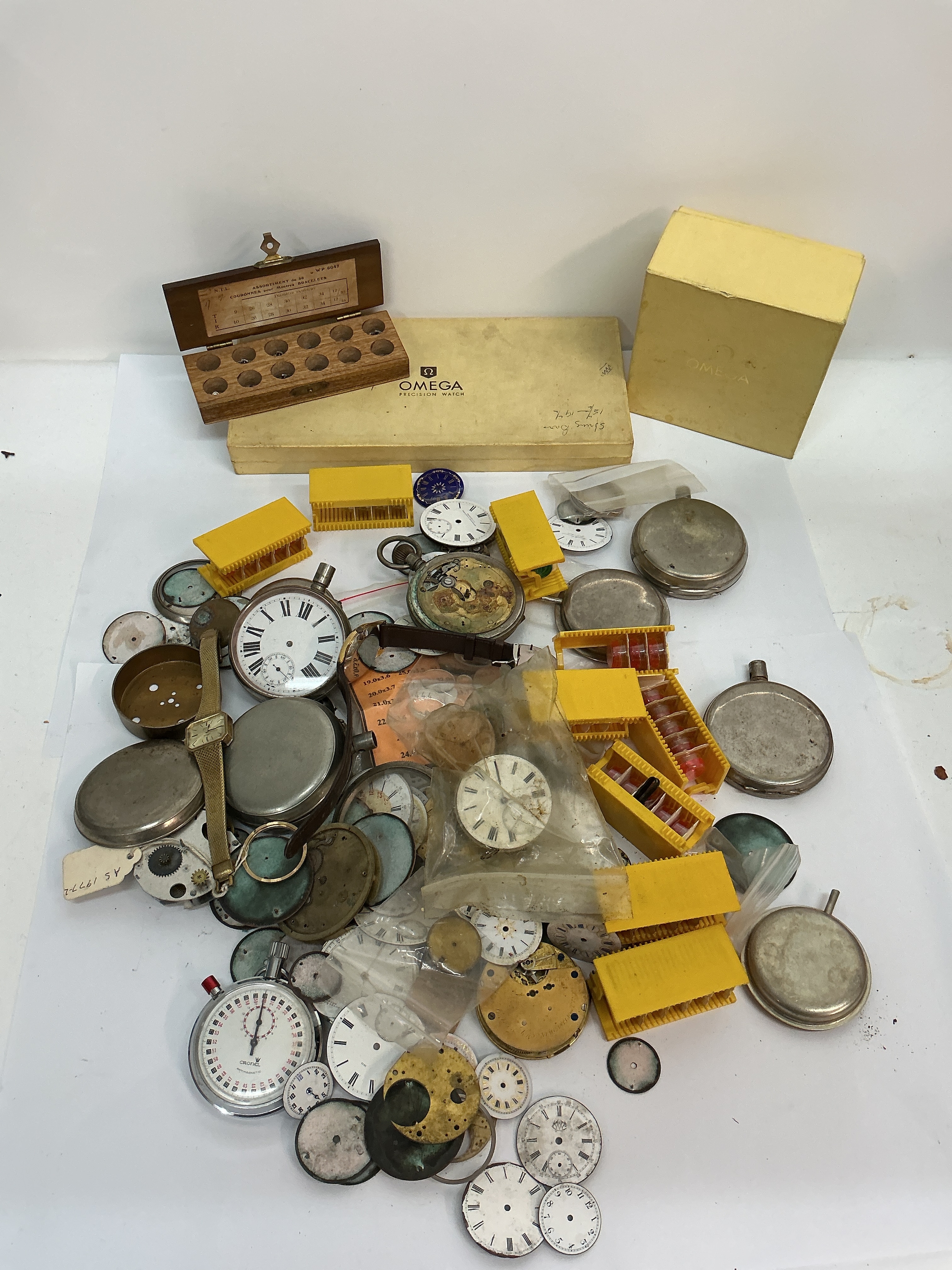 A quantity of assorted watch parts plus Omega boxes. Offered as spares or repairs 