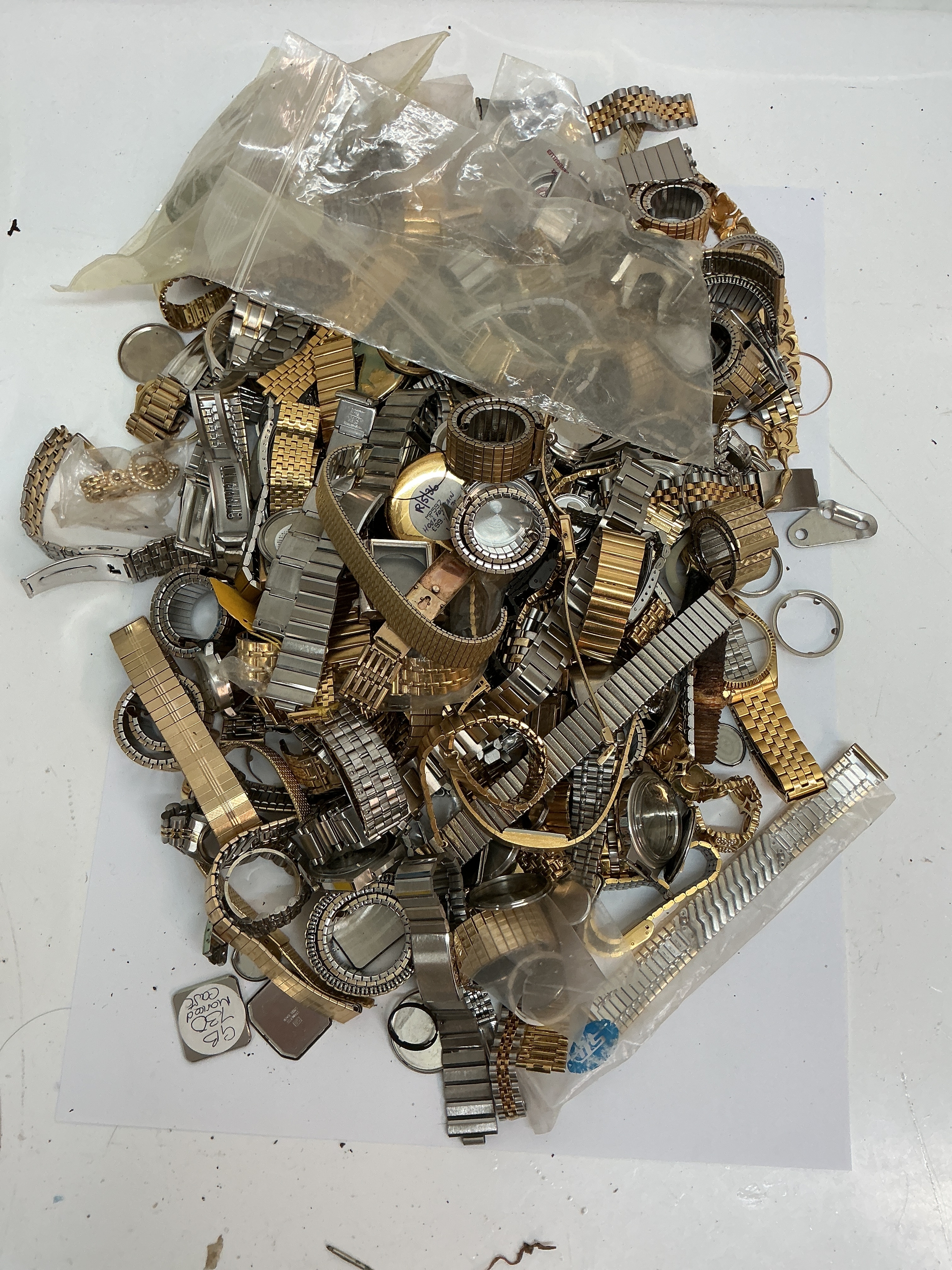 A large quantity of assorted watch straps and cases