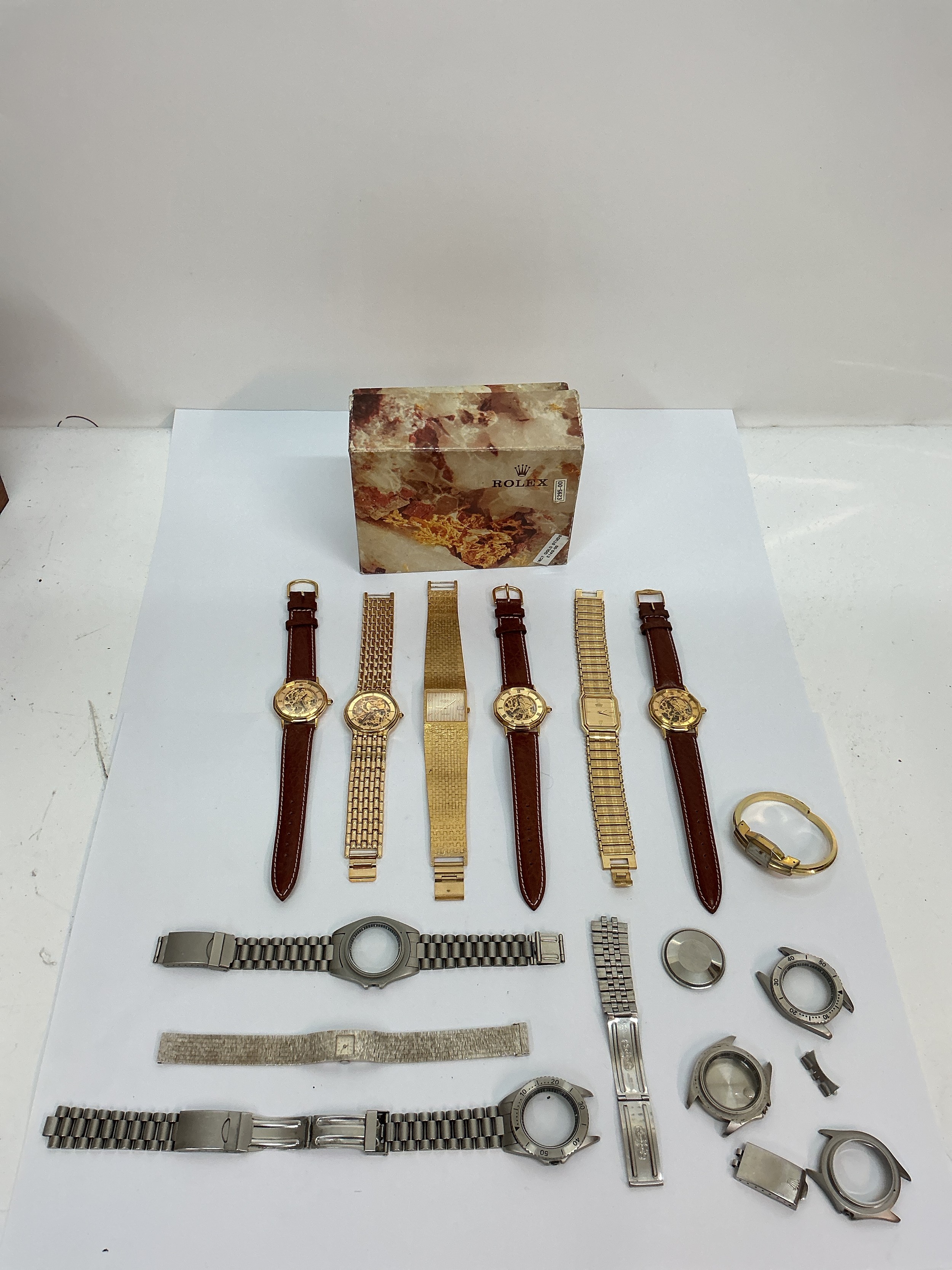 A Rolex outer watch box, plus Rotary watches, straps and dials