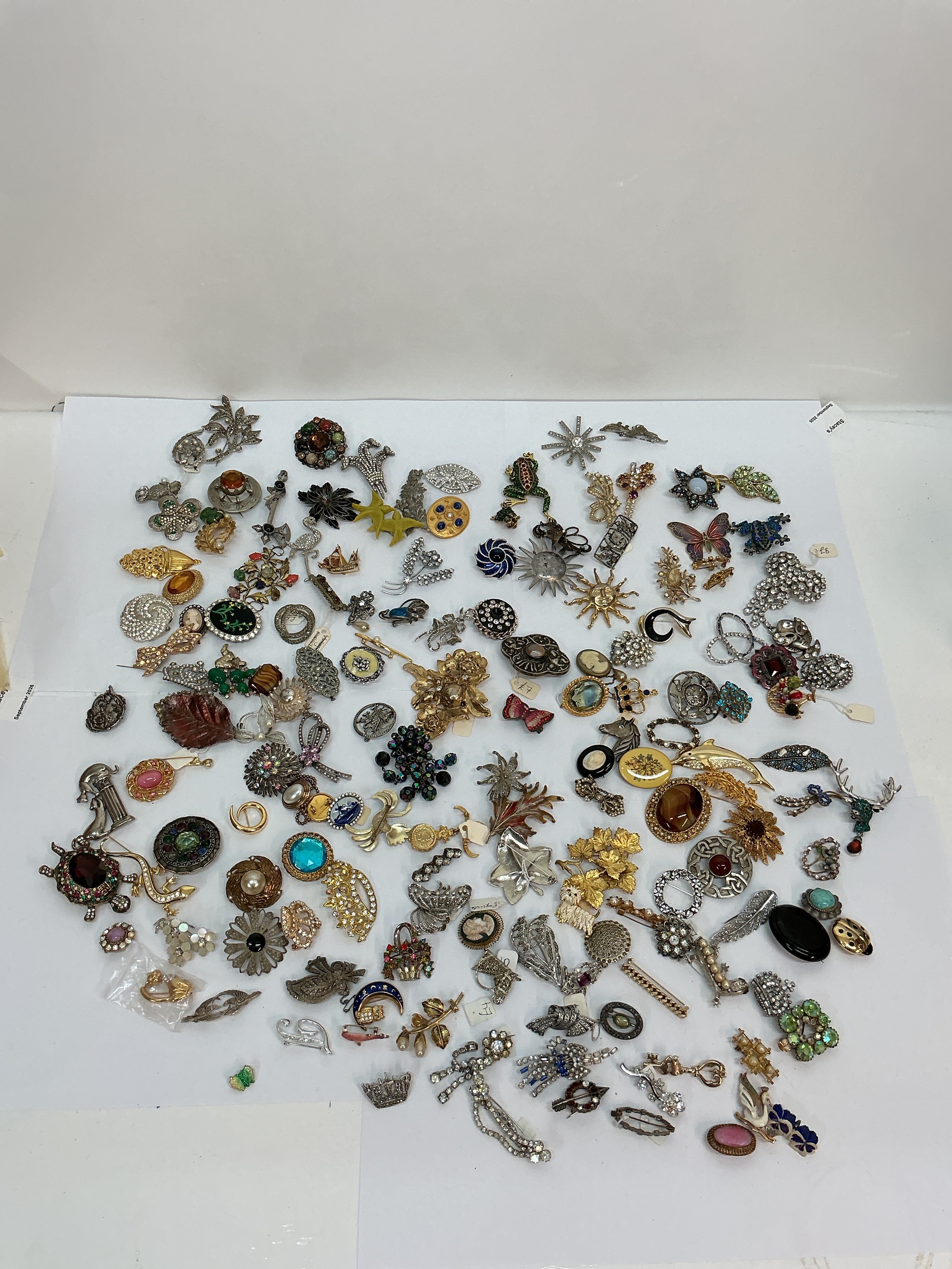 A large collection of vintage brooches including some signed examples.