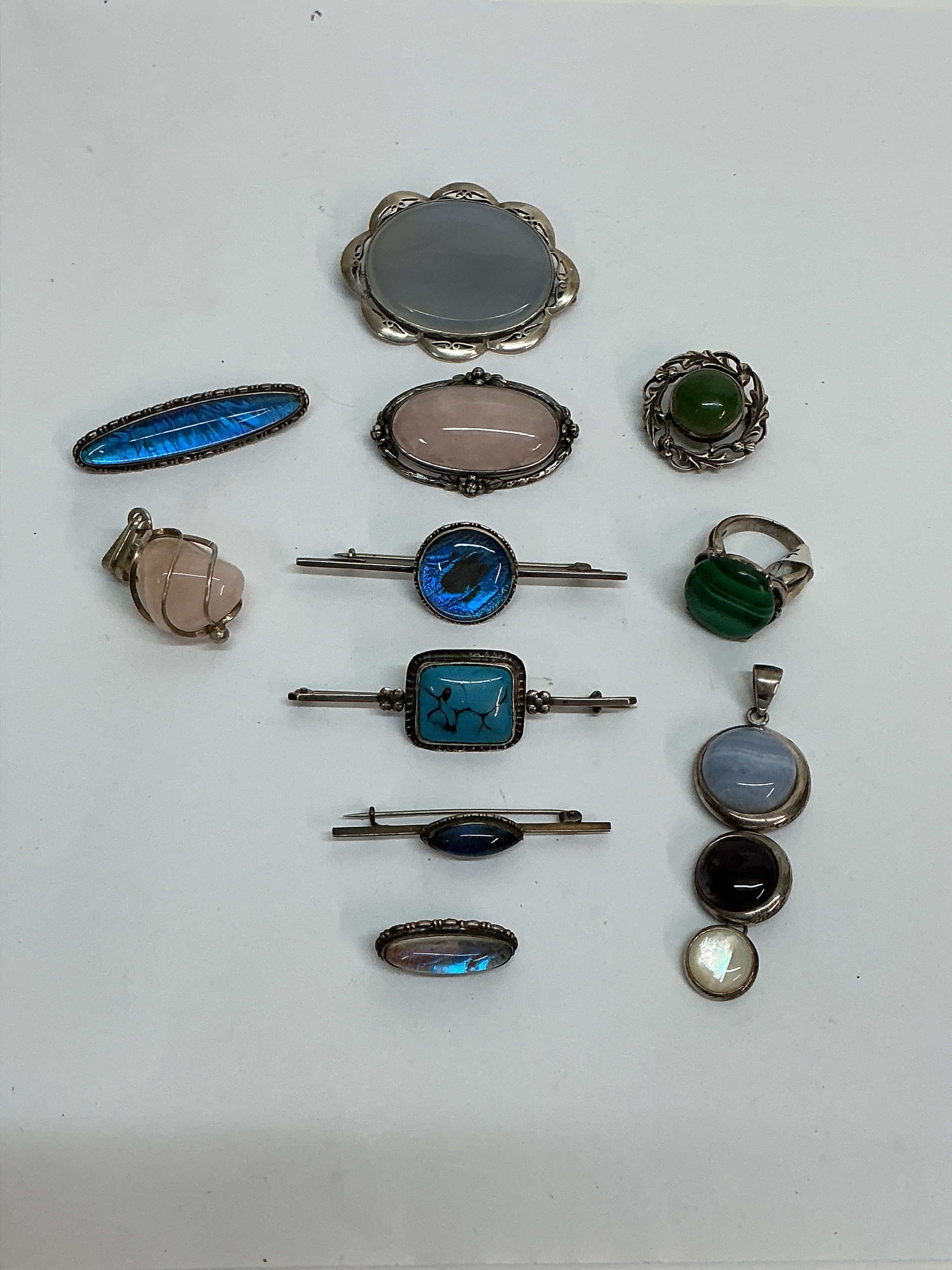 A group of silver polished stone set jewellery