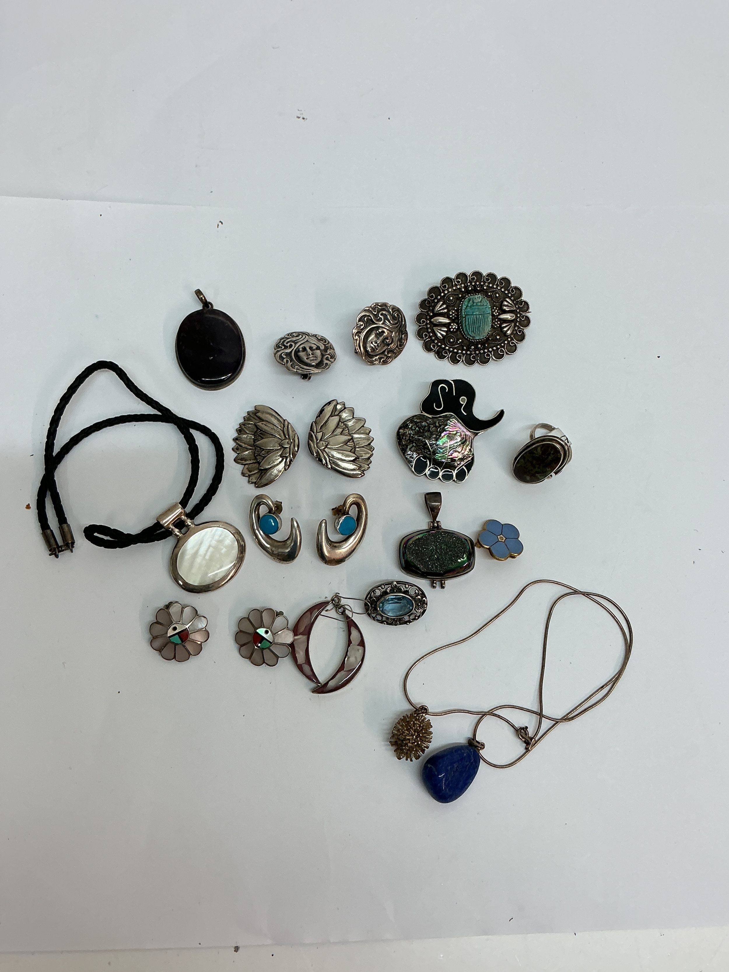 A small group of silver and white metal jewellery including a Fattorini brooch