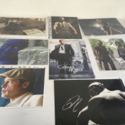 A collection of 8 signed TV and Film stars including Daniel Craig..Brad Pitt..Tom Hardy..Jennifer Lawrence Al Pacino and others.  Some with COA.