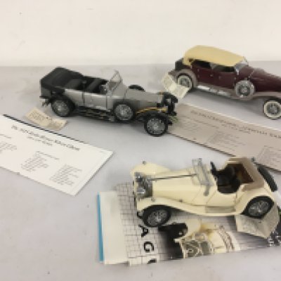 3x Franklin Mint model cars featuring a 1925 Rolls Royce Silver Ghost..1930 Dussenberg J Dereham Tourster and a  1938 Jaguar SS100 all 1..24 scale.  No reserve