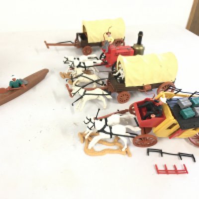 A selection of Timpo plastic models featuring wagons..horses..people..canoe.  Some damage.  No reserve