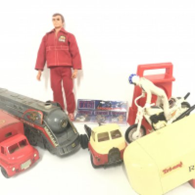 A S:all Collection Of Vintage Toys. A Six Million Dollar Man. A Evel Knievel. A Tri-Ang Removal Lorry. A Batmobile And Bat Copter. etc.