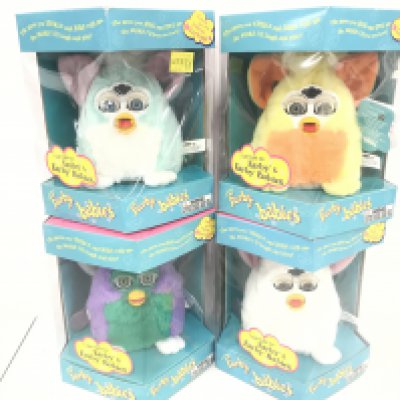 4 Boxed And Sealed Tiger/Hasbro Furby Babies. Including Snowy. Sunny Yellow. Very Purple And Mint Green.