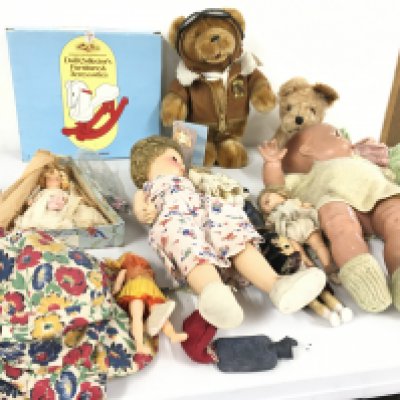 A collection of vintage dolls with assorted clothing accessories also soft toys limited edition teddy bear commemorative of 100 years flight.  Plus a dog.  No reserve 