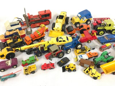 Box of assorted die cast vehicles including Corgi and Tonka etc and a vintage multi story garage.