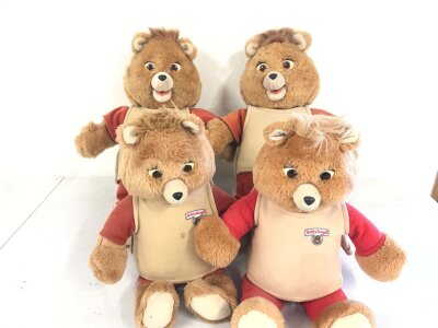 Four Teddy Ruxpins two different sizes.