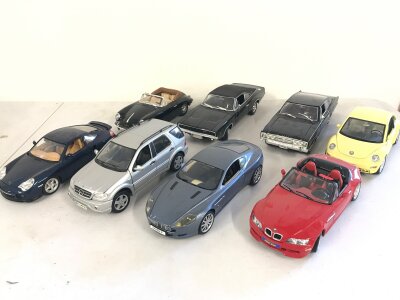 8 x 1:18 scale die cast cars including Aston Martin BMW etc.