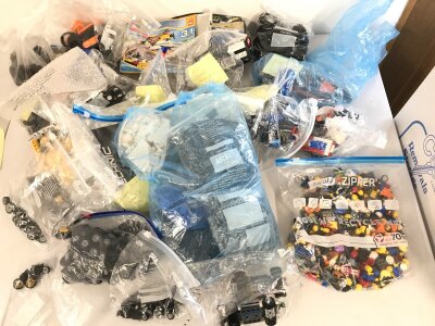 A large collection of loose set sets some with corresponding boxes.