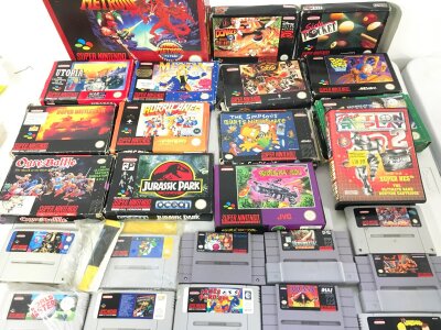 A Collection of 14 Boxed Super Nintendo Games (Simpsons Has No Instructions) And 25 Loose.