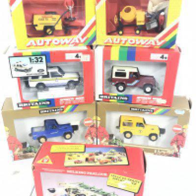 A Collection Of Boxed Britains Land Rovers. Autoway Sets And A Milking Parlour.(7).