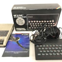 A Boxed Sinclair ZX Spectrum. With Tape Deck And Games.