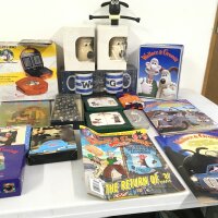 A varied collection of Wallace and Gromit merchandise, including Toastie maker, Mugs, handkerchiefs , braces , tin of biscuits ( not for eating) etc.  no reserve