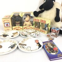 A varied collection of Wallace and Gromit merchandise including Display figures, cheese plates, plush Shaun the Sheep.  No reserve