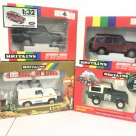 4 Boxed Britains Land Rovers Including 2 X Land Rover Discoverys. A Police Land Rover and A National Trust Land Rover. (4).