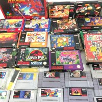 A Collection of 14 Boxed Super Nintendo Games (Simpsons Has No Instructions) And 25 Loose.
