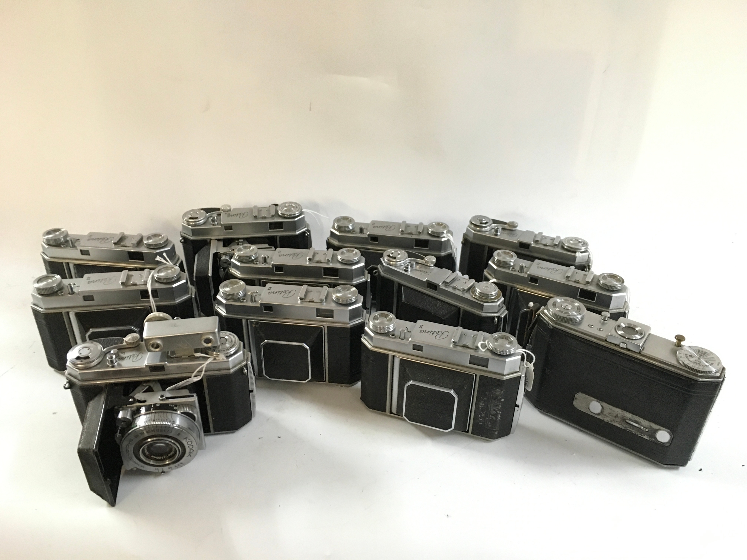 A collection of various Kodak cameras including Kodak Retina II, Ia, IIa, and a Kodak Duo 620. 