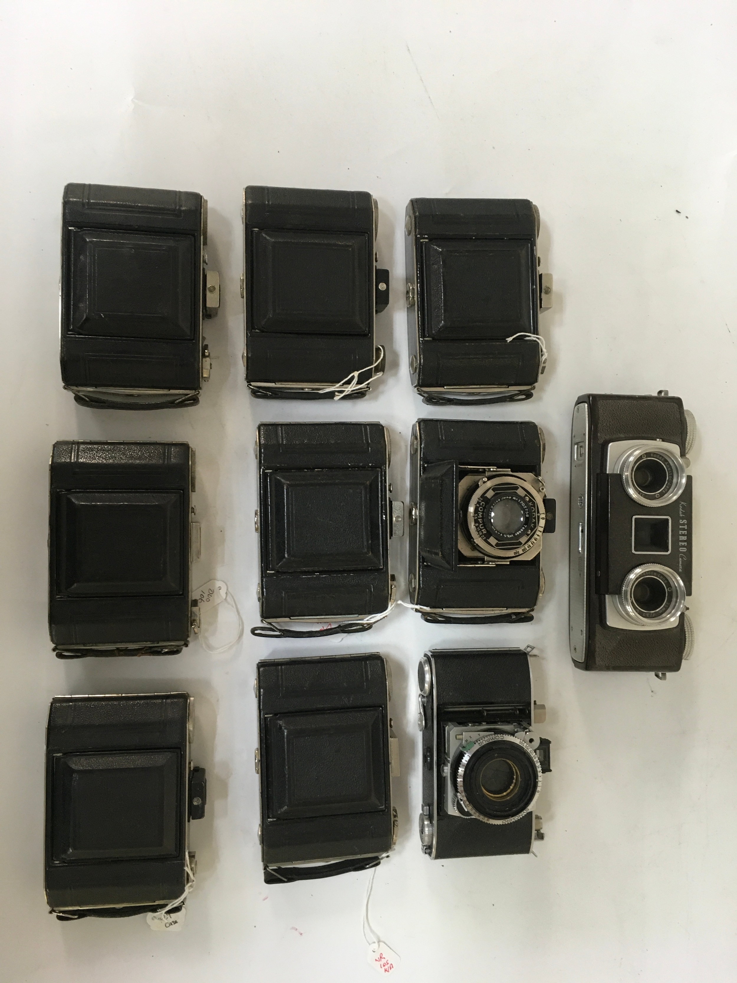  10 cameras, x 1 Kodak stereo camera, x 1 Kodak Synchro Compur, x8 Kodak Compur. 