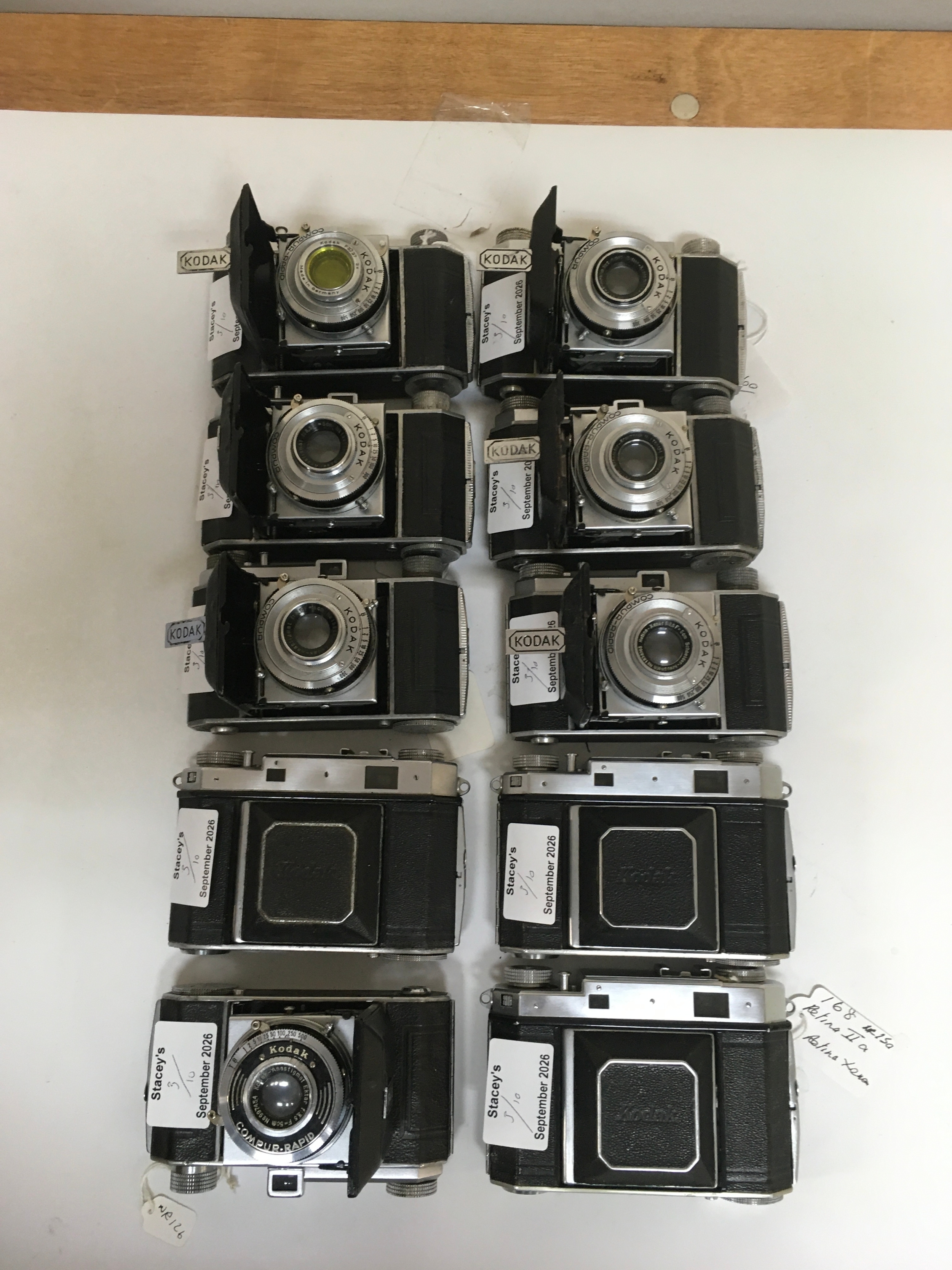 10  Kodak Compur Rapid image cameras. 1 slight variation in having a yellow lens.