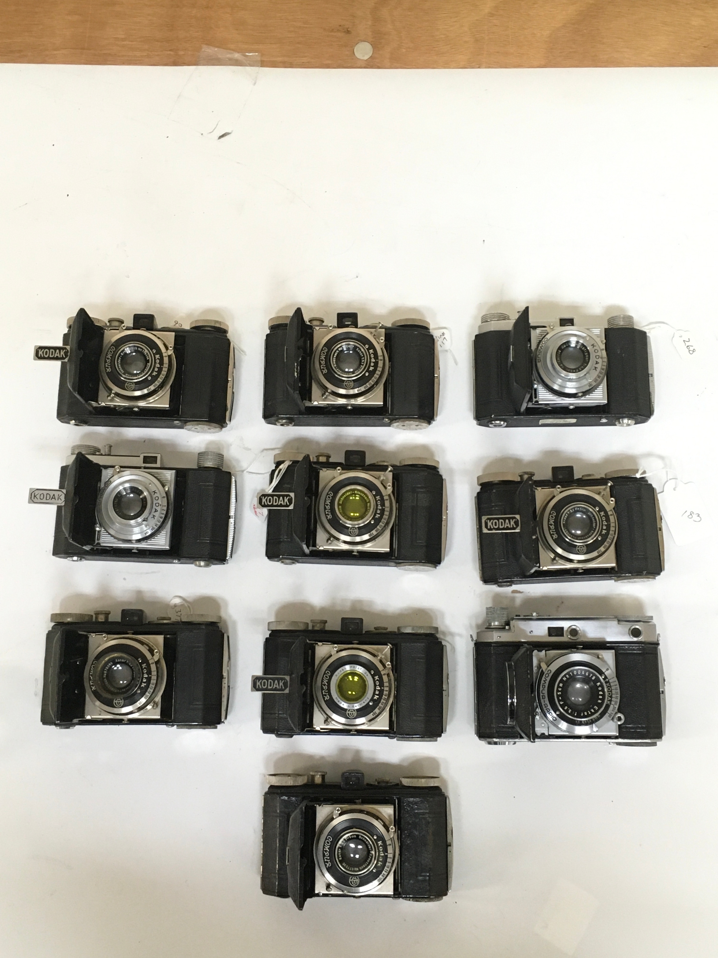 X10 items. X 9  Kodak  Compur  and x1 Kodak Compur Rapid Cameras. lot includes  2 with  additional yellow lens colour  variation and lens hood.