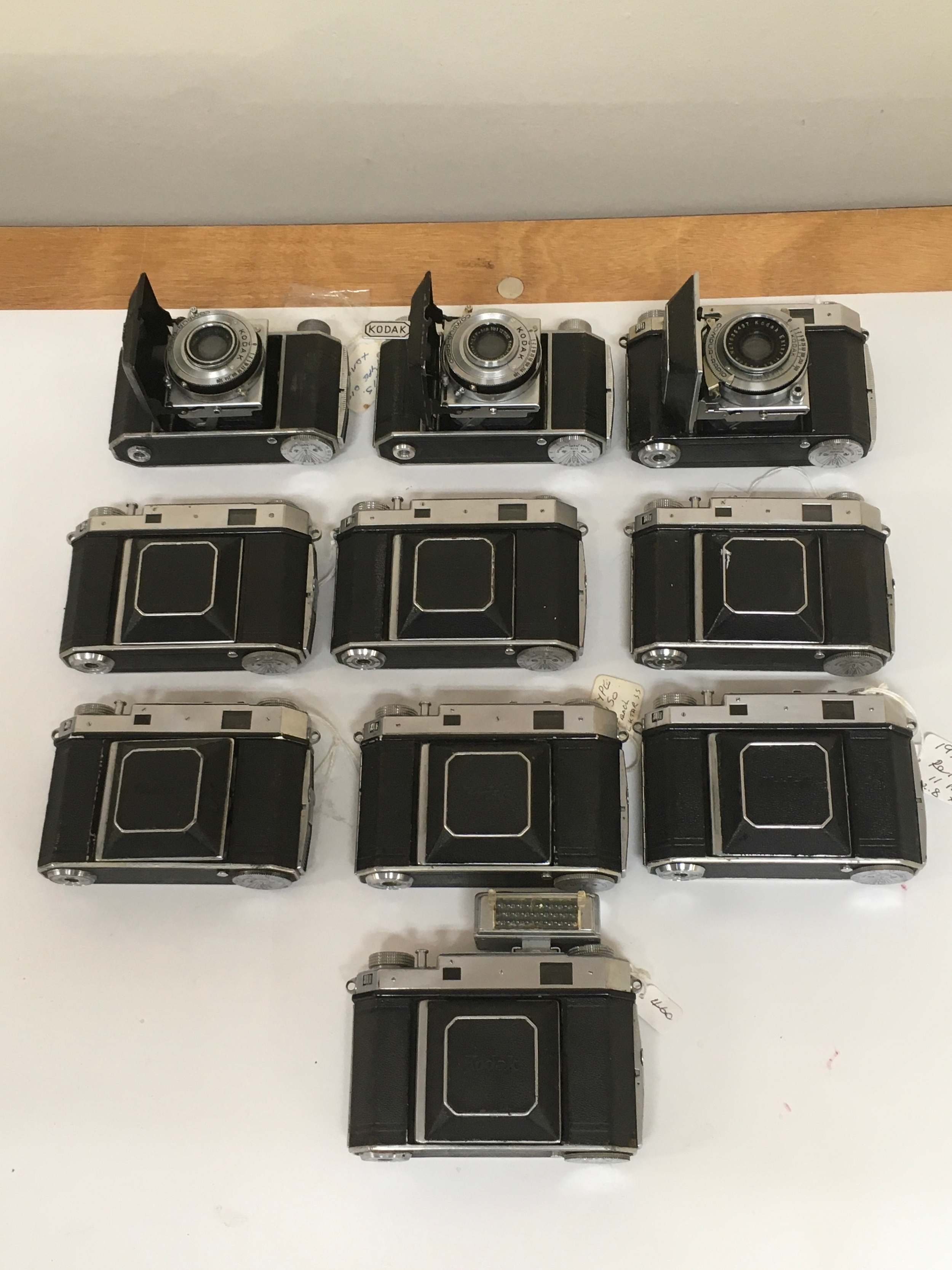 10 Kodak Compur-Rapid image Cameras. 1 having a flash capability.