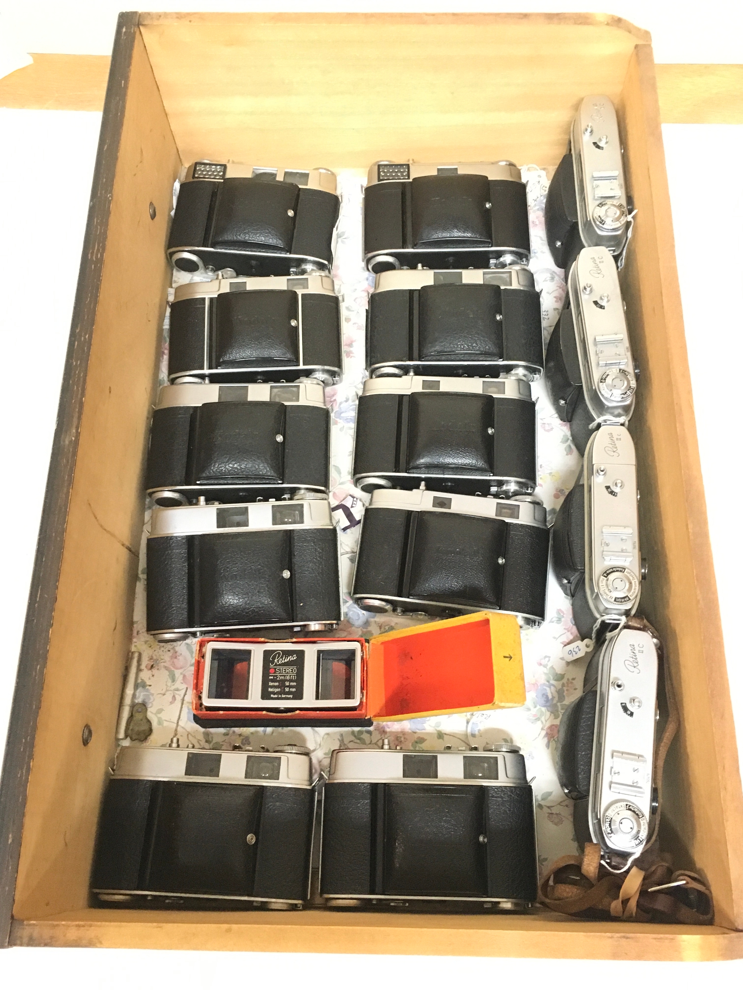 15 items. 2,  Kodak Retina I B cameras. 12 Retina II C cameras, one clues strap. , Kodak Stereo Attachment.