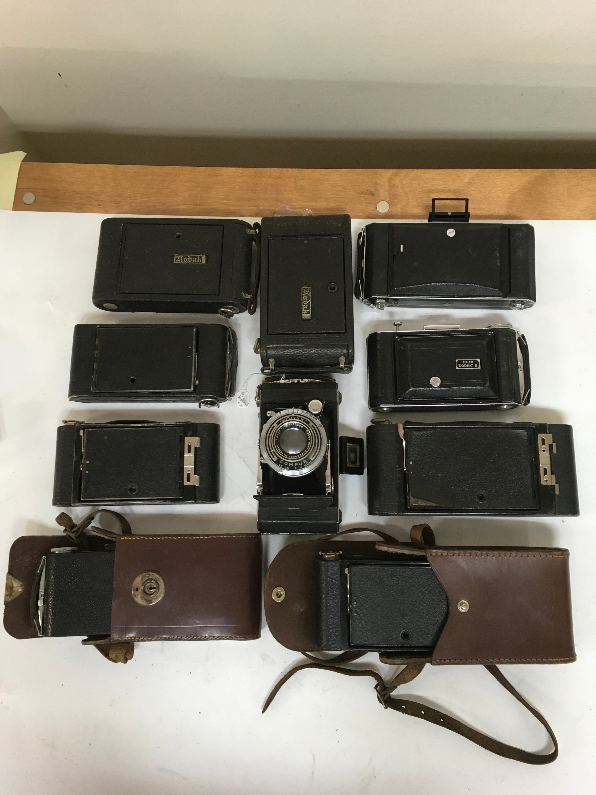 10 Kodak and Kodak Six-20 B, Folding Autographic  Brownie cameras. Includes 2 holsters/ carriers. .