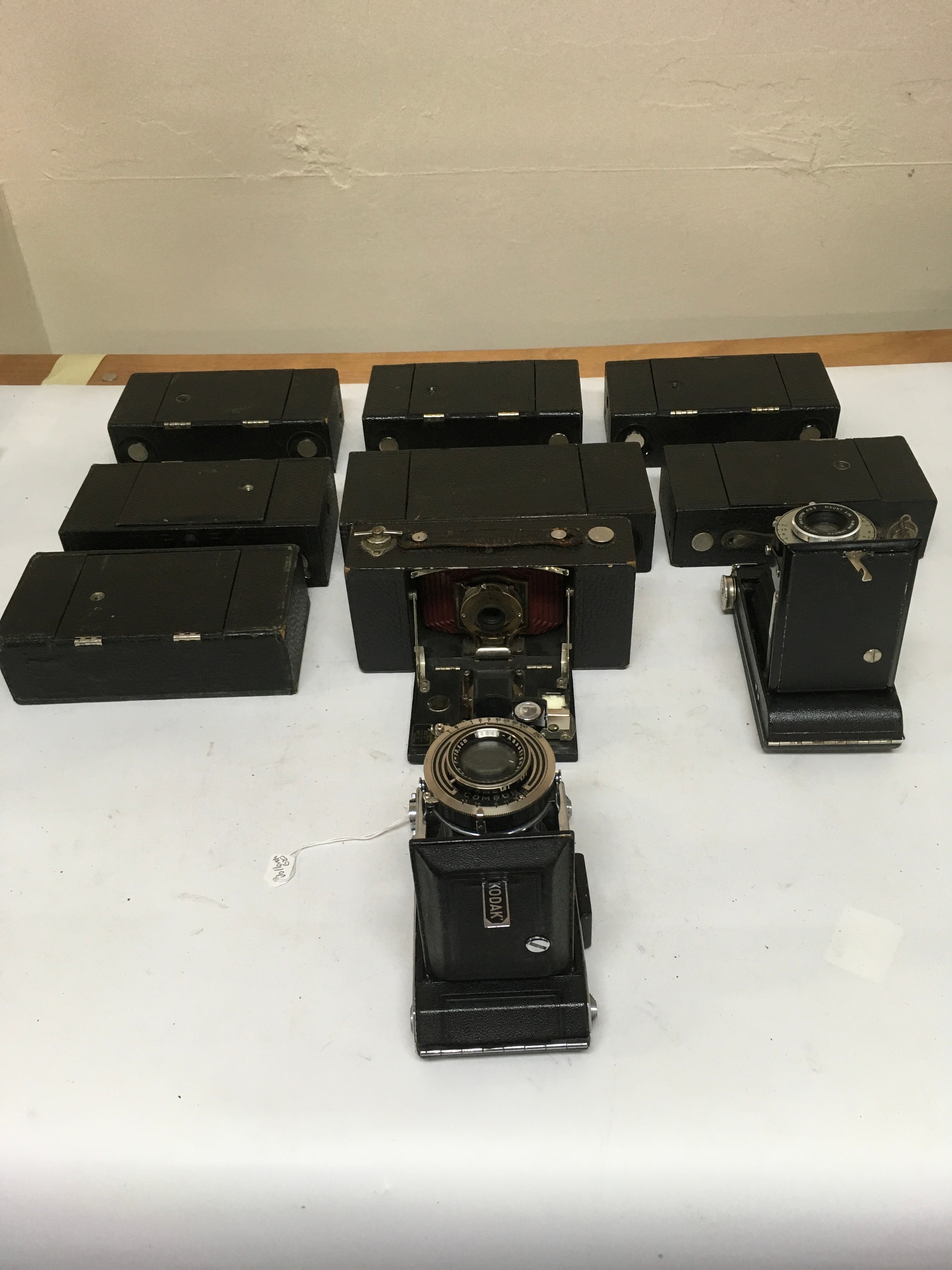 10 Kodak cameras. 8 Folding Brownie Automatics. 1 Brownie Damon Shutter. 1 Kodak Compur.
