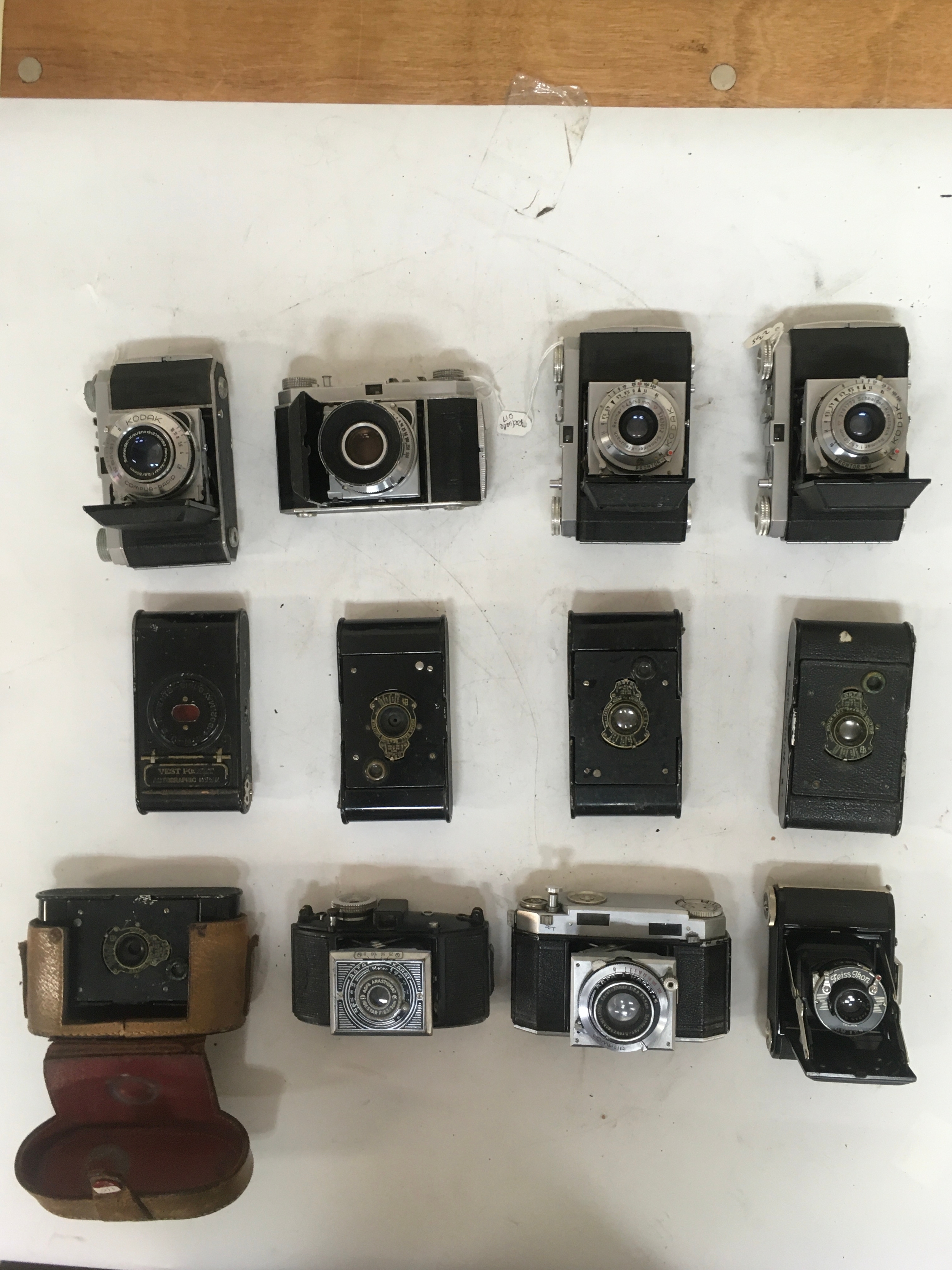 12 Cameras.   4 Kodak variants KodakProntor-SV, Compur/ Rapid. 1  AGFA Karat Compur, 1 AGFA Anastigmat Igestar. 5,  Vest pocket Kodaks. 1 includes holster.  1 Zeiss Ikon TELMA.