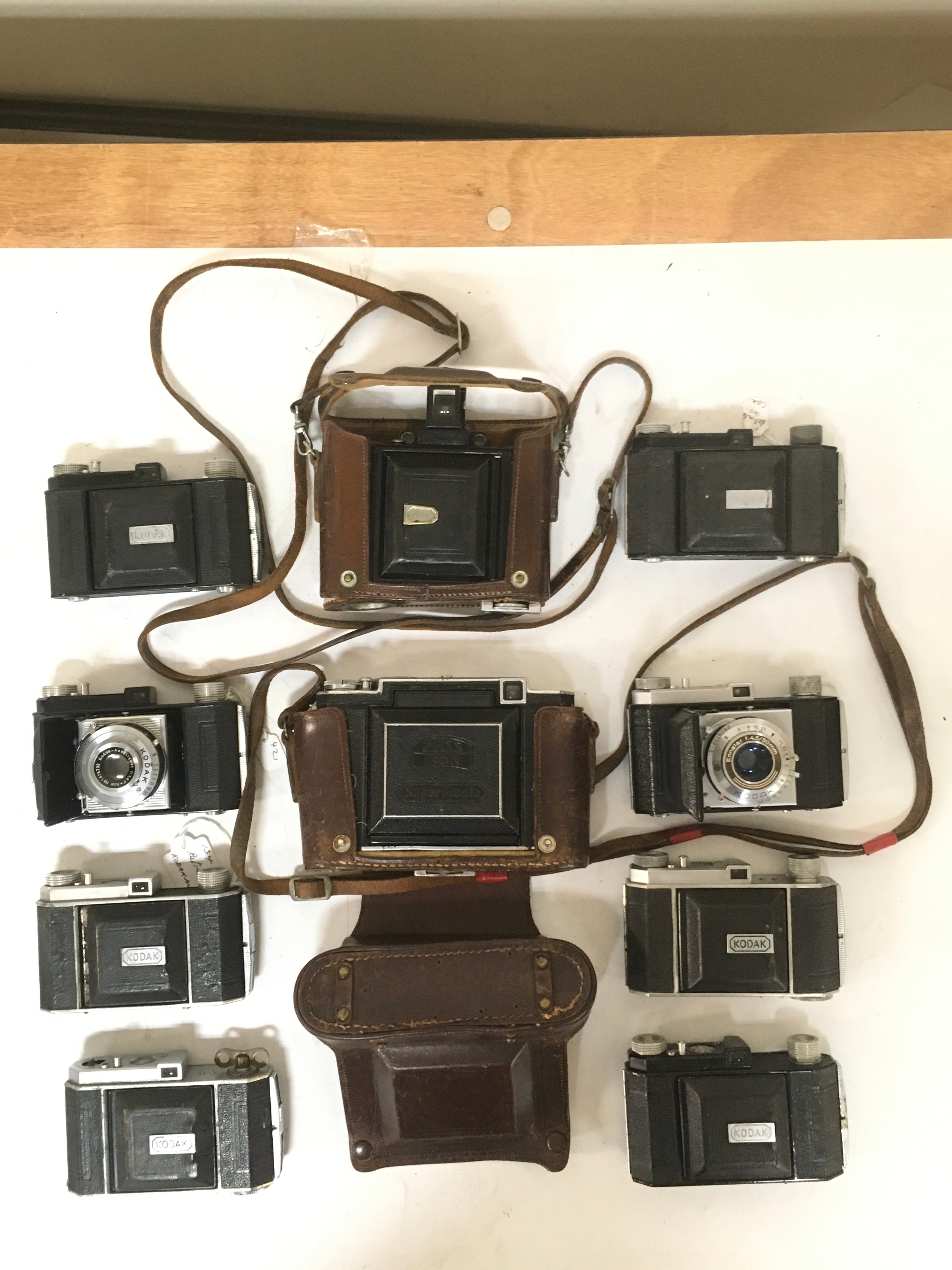 10 Cameras 2  variations of the Zeiss Ikon, Super Ikonta with Carriers/ holsters. 8 Kodak Compur and Prontor-S. 